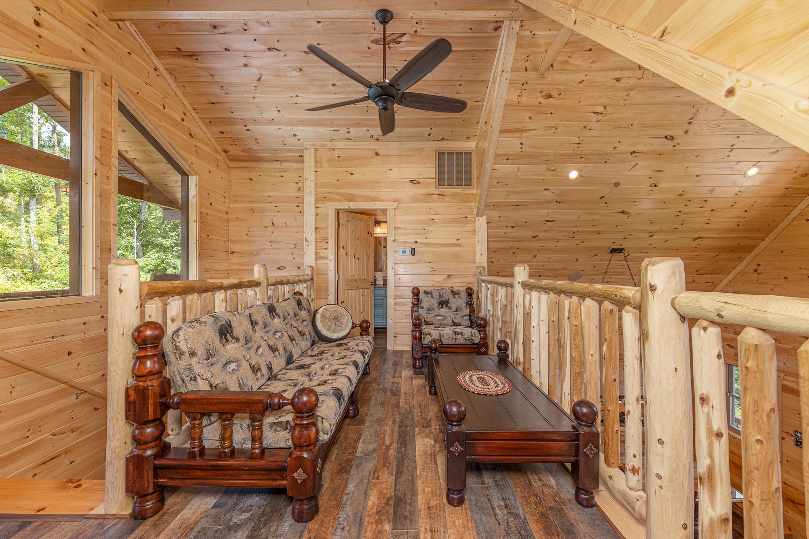 Loft seating area at Twin Peaks, a 5 bedroom cabin rental located in Gatlinburg
