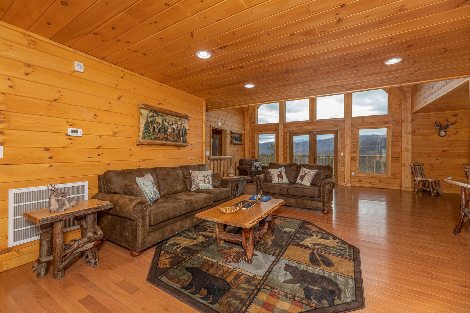 Sofa, loveseat, and coffee table at J's Hideaway, a 4 bedroom cabin rental located in Pigeon Forge