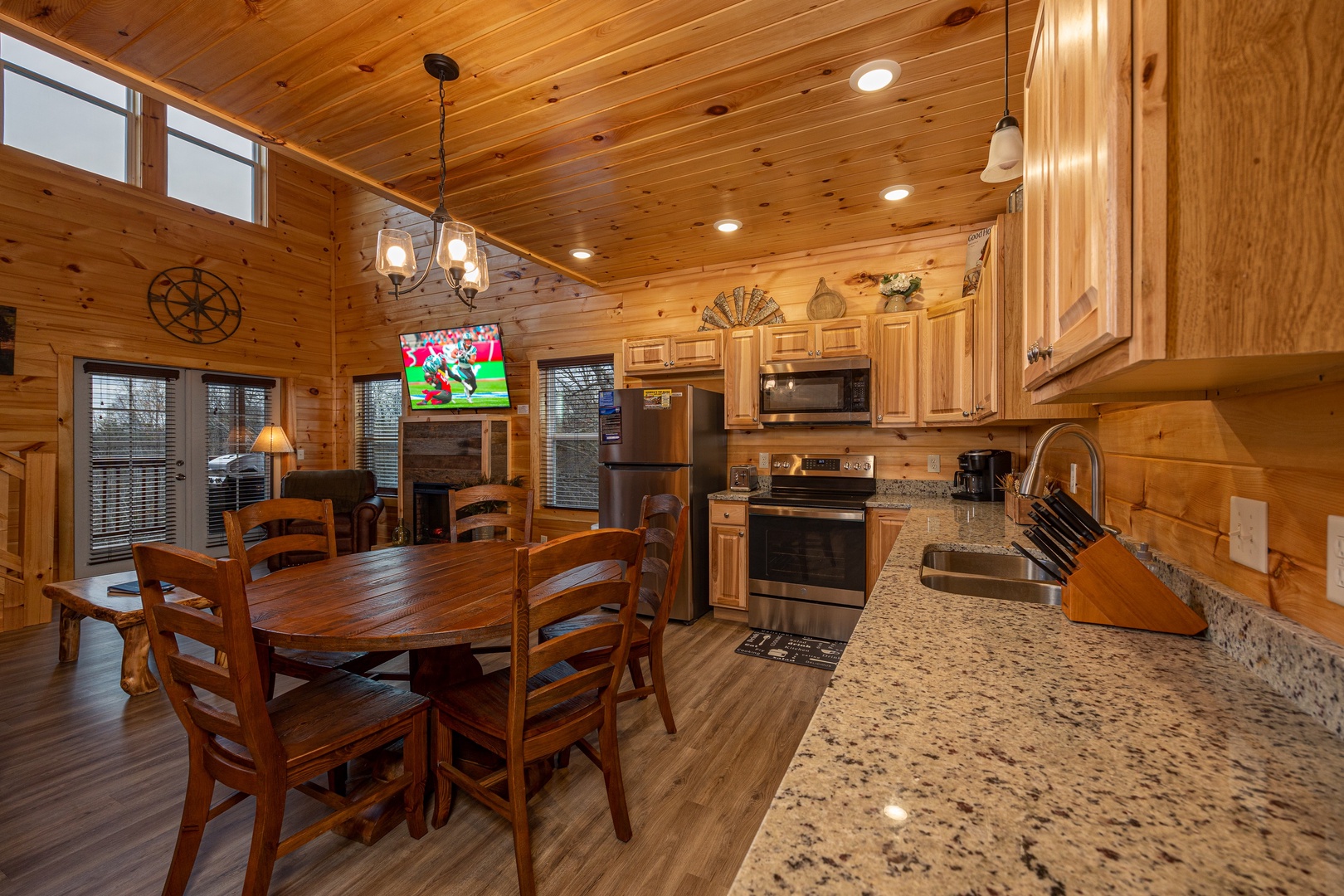 Kitchen table and appliances at Mountain Pool & Paradise, a 3 bedroom cabin rental located in Pigeon Forge