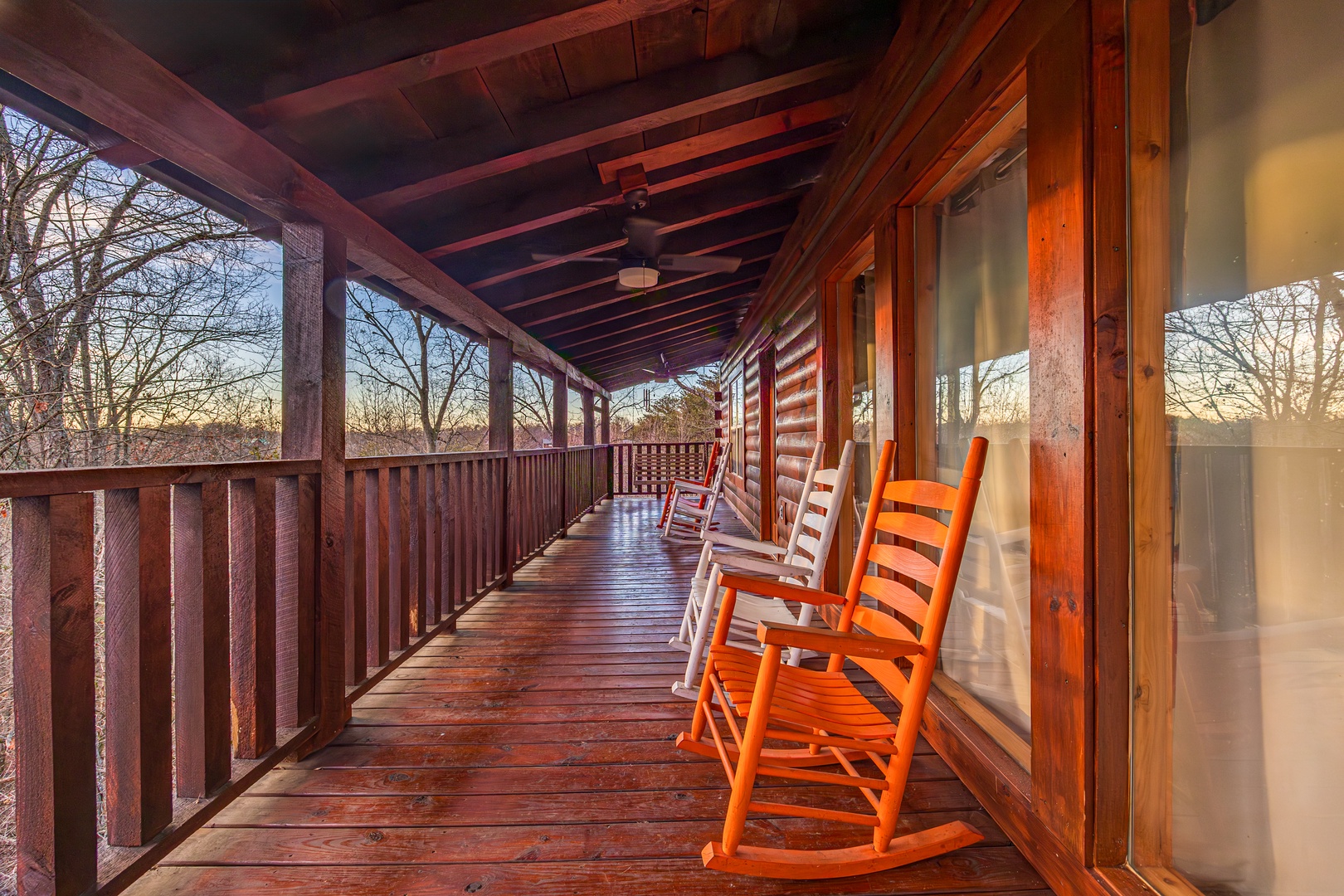 Rocking Chairs on Porch at Hickernut Lodge, a 5-bedroom cabin rental located in Pigeon Forge