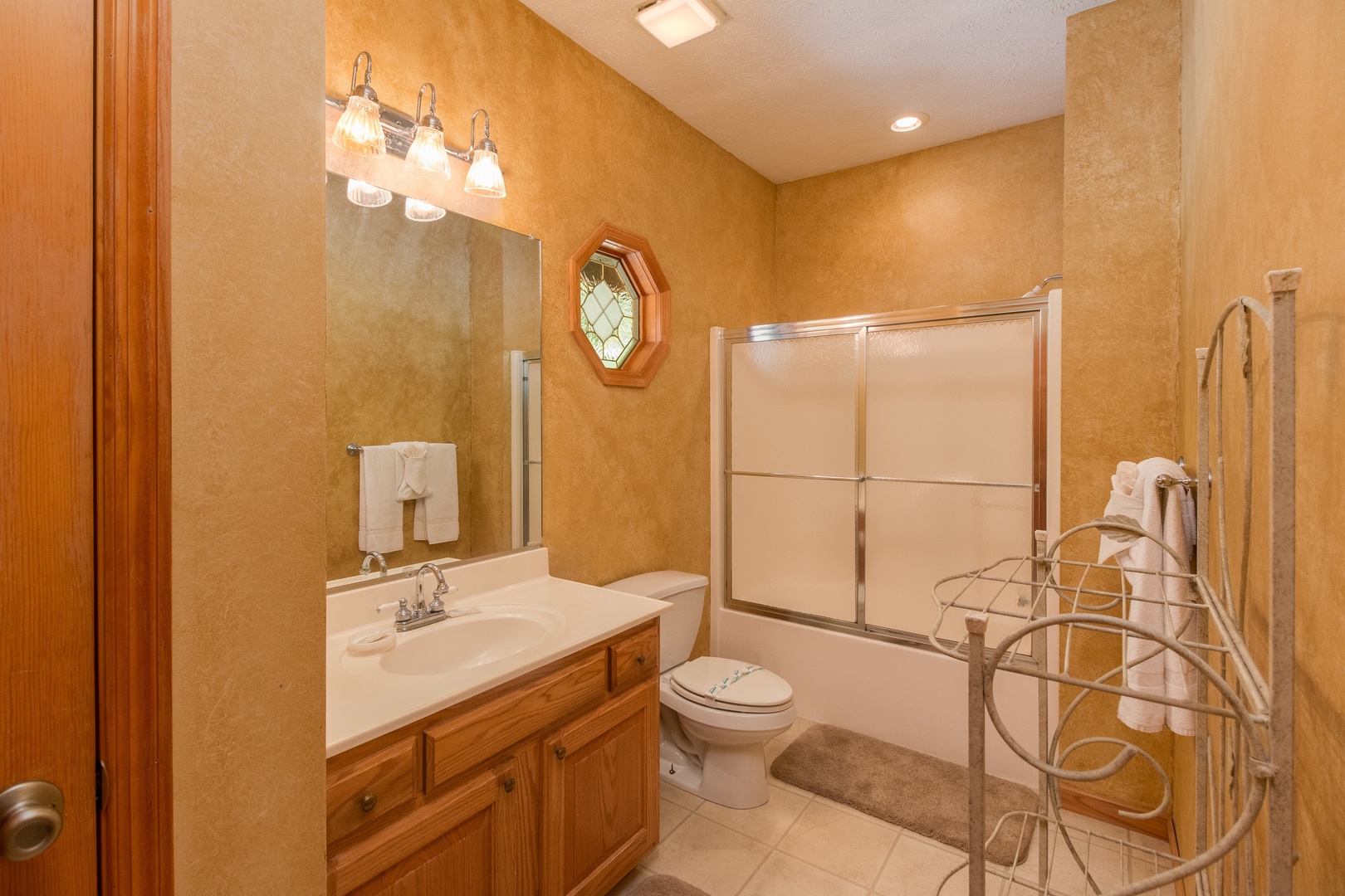 Bathroom with a tub and shower at Stones Throw, a 4 bedroom cabin rental located in Pigeon Forge