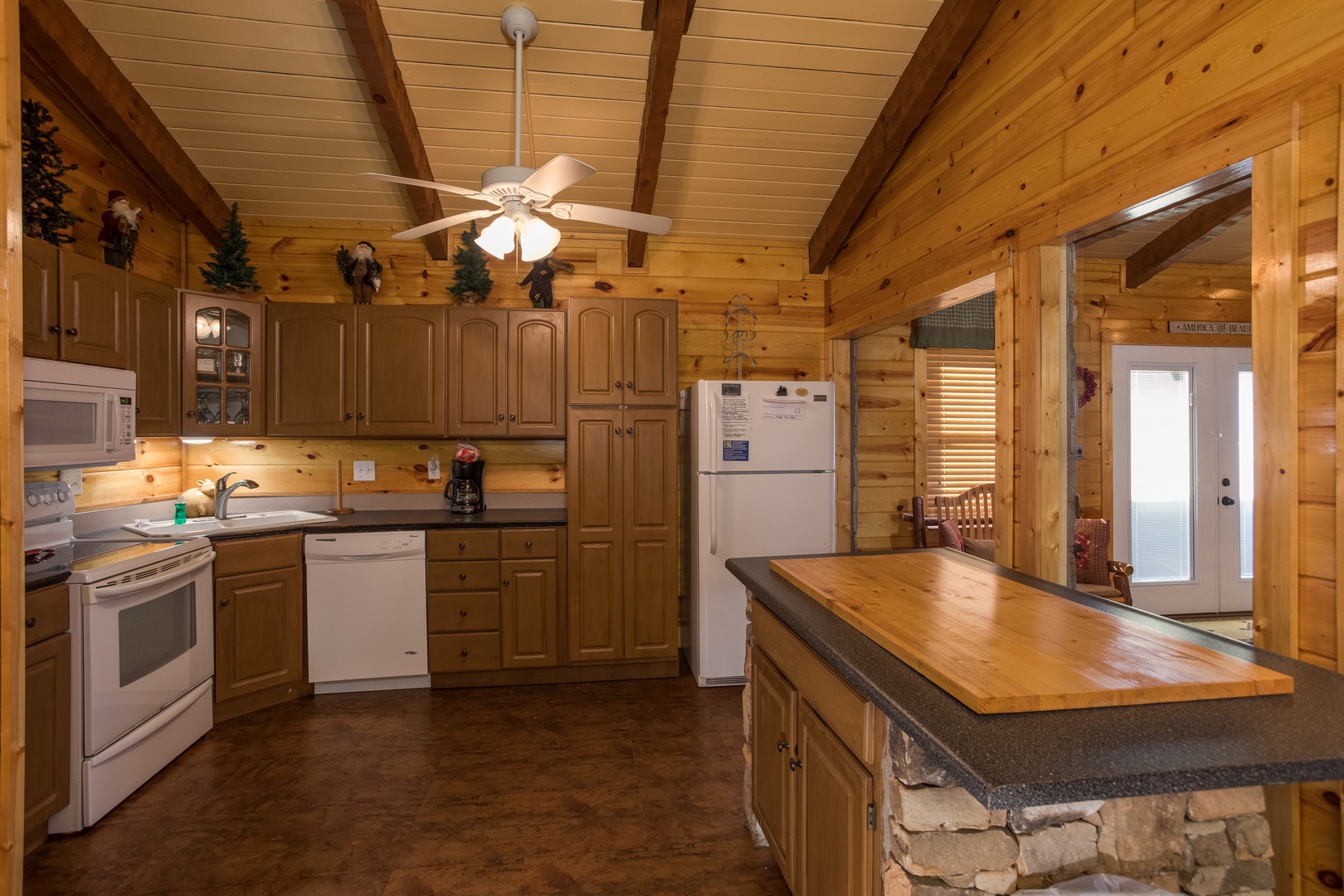 Kitchen with white appliances at Rustic Ranch, a 2 bedroom cabin rental located in Pigeon Forge