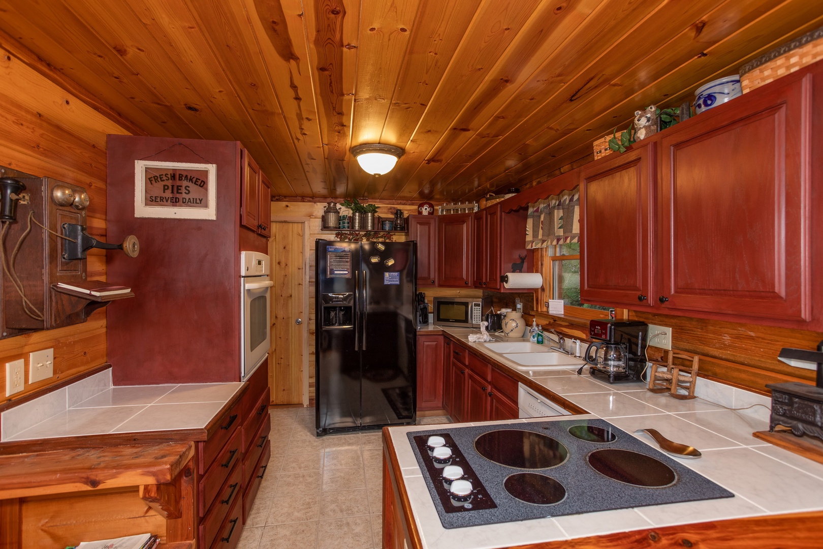 Kitchen at Moonshiner's Ridge, a 1-bedroom cabin rental located in Pigeon Forge