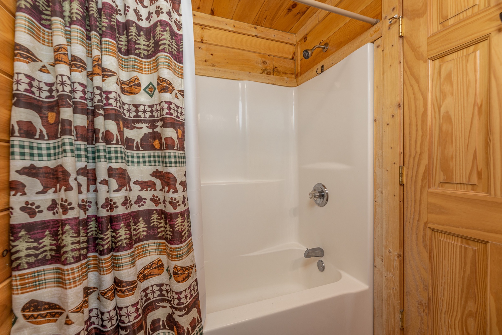 Bathroom with a tub and shower at Bears Don't Bluff, a 3 bedroom cabin rental located in Pigeon Forge
