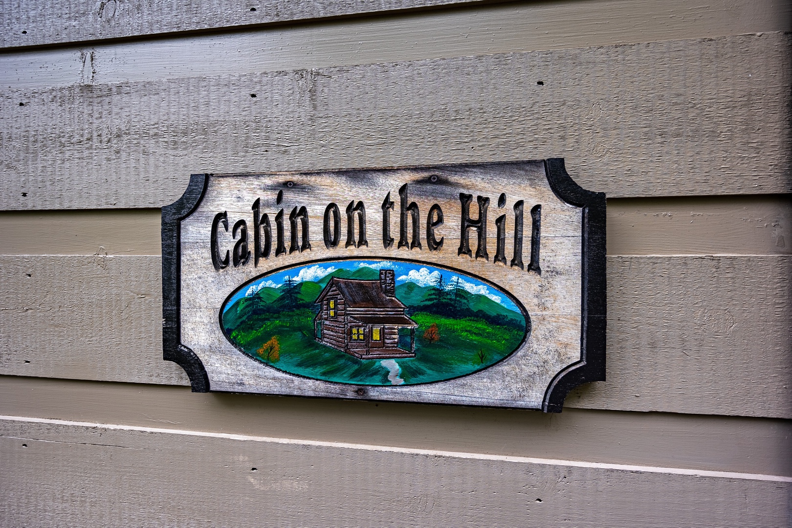 Sign at Cabin On The Hill, a 1 bedroom cabin rental located in Pigeon Forge