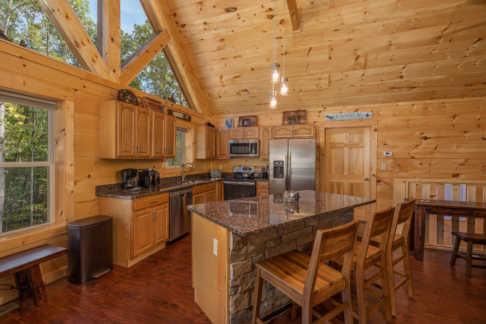 Breakfast bar, dining space, and kitchen at Gar Bear's Hideaway, a 3 bedroom cabin rental located in Pigeon Forge