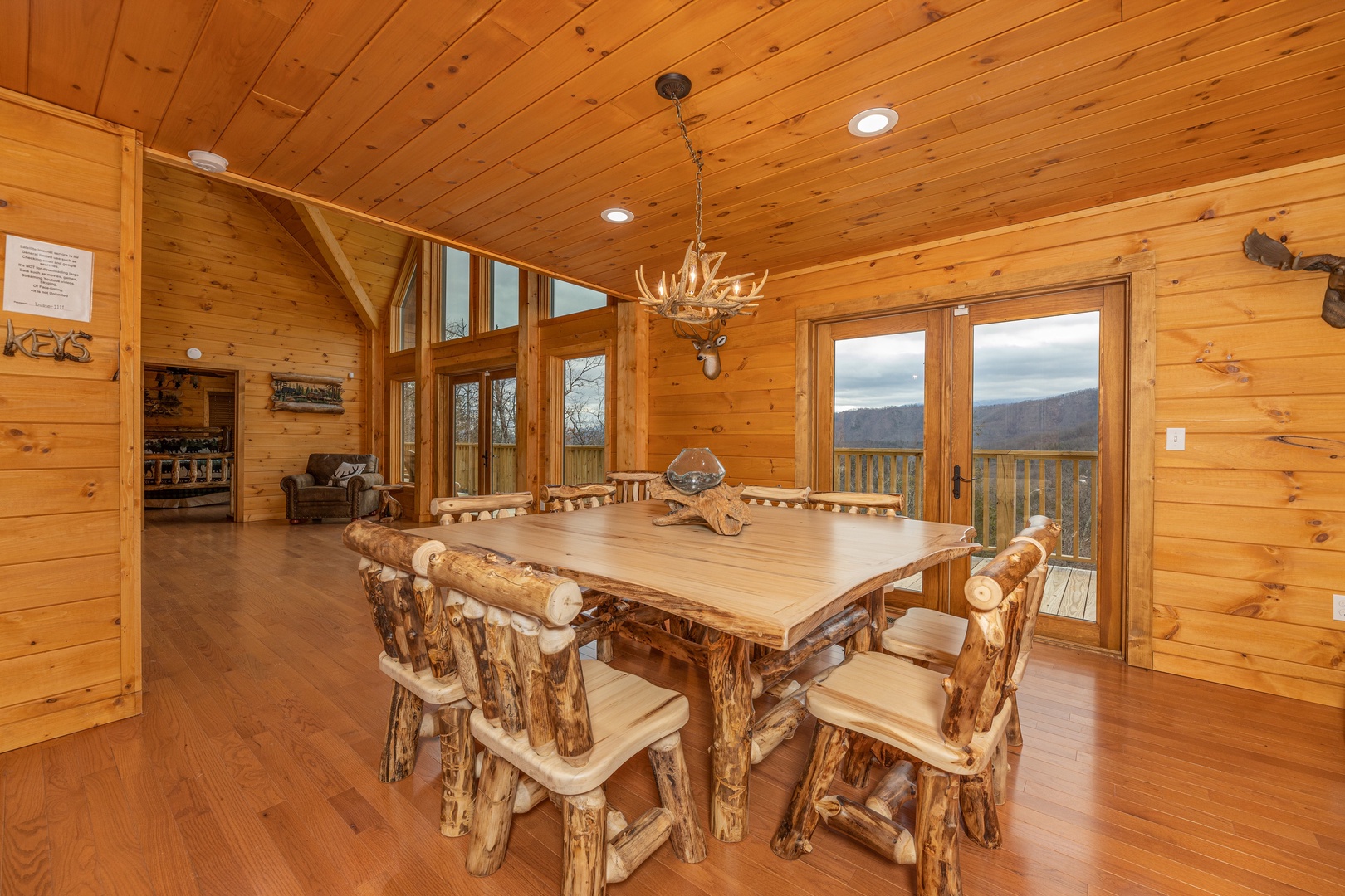 Dining room with table for 8 at J's Hideaway, a 4 bedroom cabin rental located in Pigeon Forge