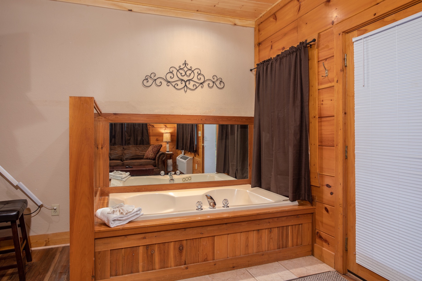 Jacuzzi in the lower living area at Starry Starry Night #725, a 2 bedroom cabin rental located in Pigeon Forge
