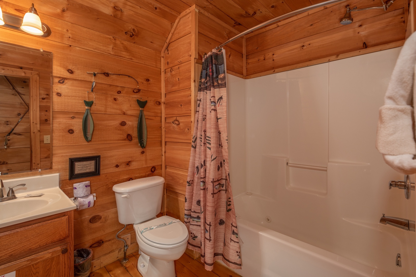 Bathroom with a tub and shower at Logan's Smoky Den, a 2 bedroom cabin rental located in Pigeon Forge