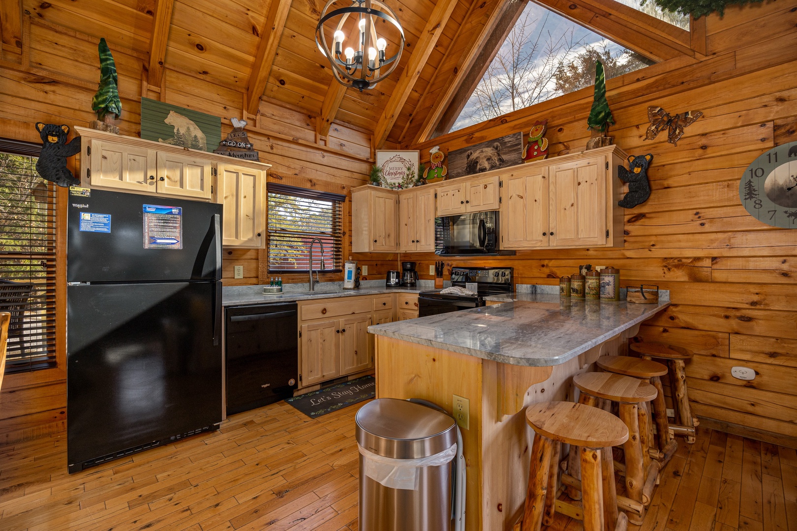 Kitchen with breakfast bar seating for 4 at Bear Feet Retreat, a 1 bedroom cabin rental located in pigeon forge