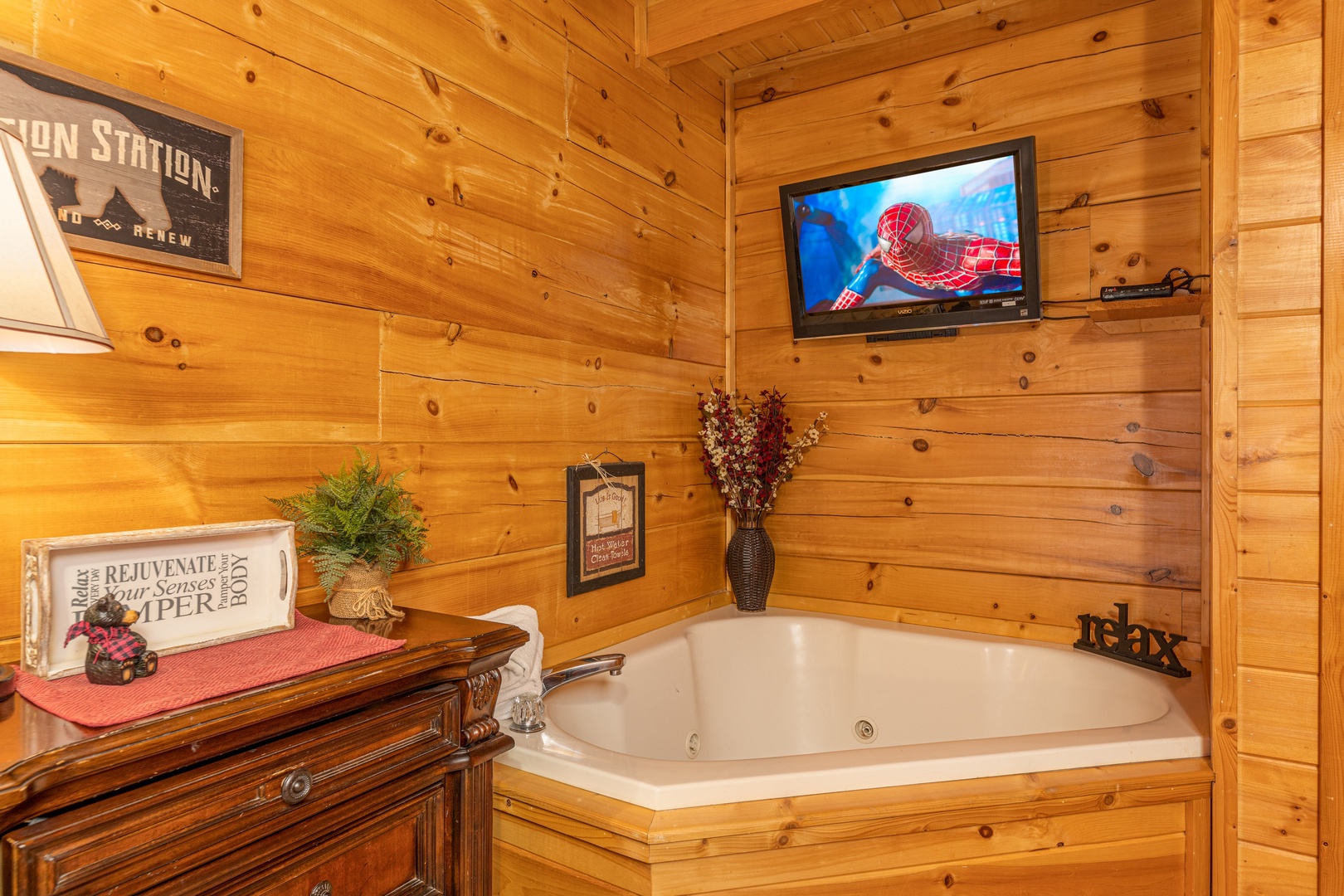 Jacuzzi and TV in a bedroom at Absolutely Wonderful, a 2 bedroom cabin rental located in Pigeon Forge
