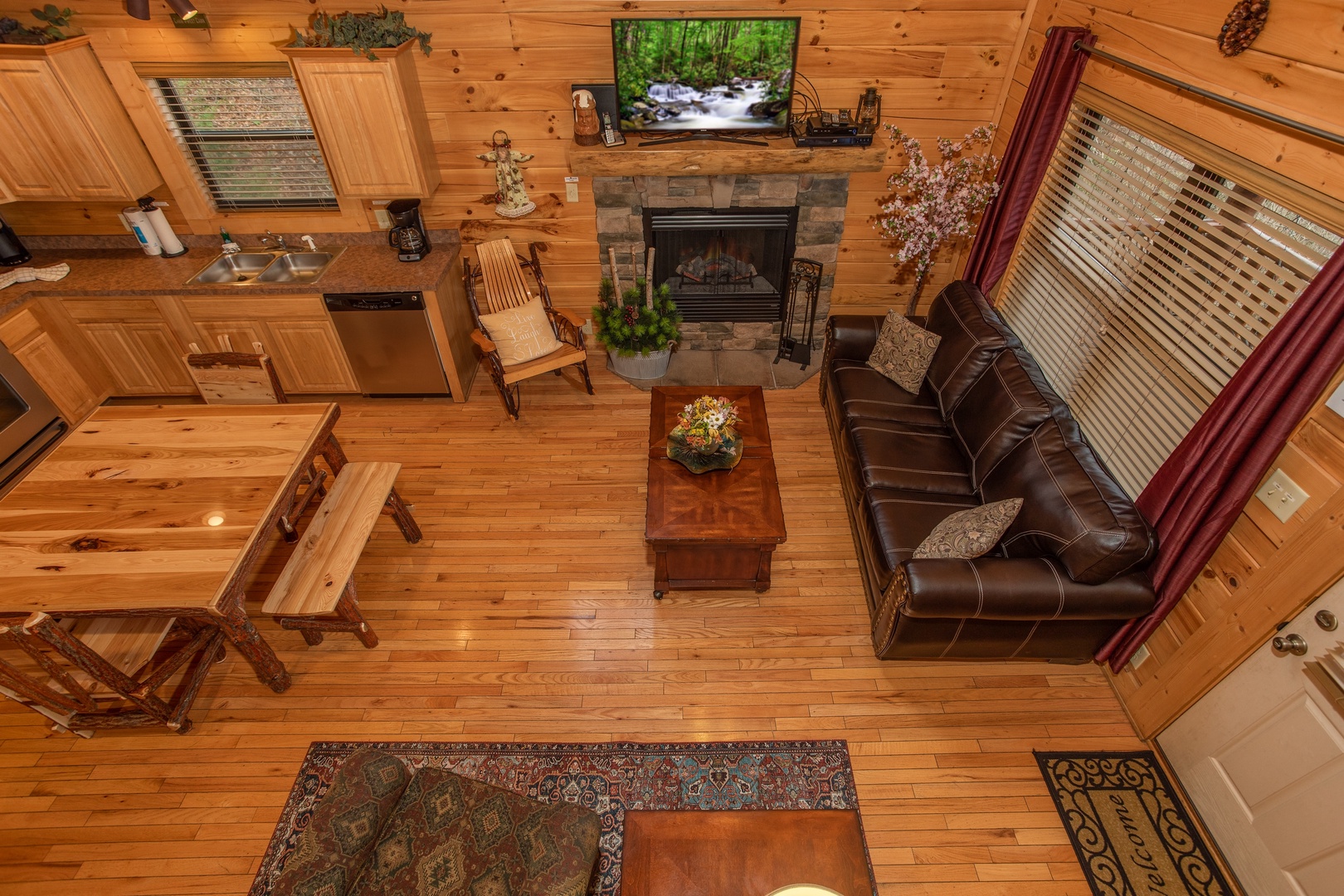 Looking down into the living room at Let the Good Times Roll, a 2 bedroom cabin rental located in Pigeon Forge