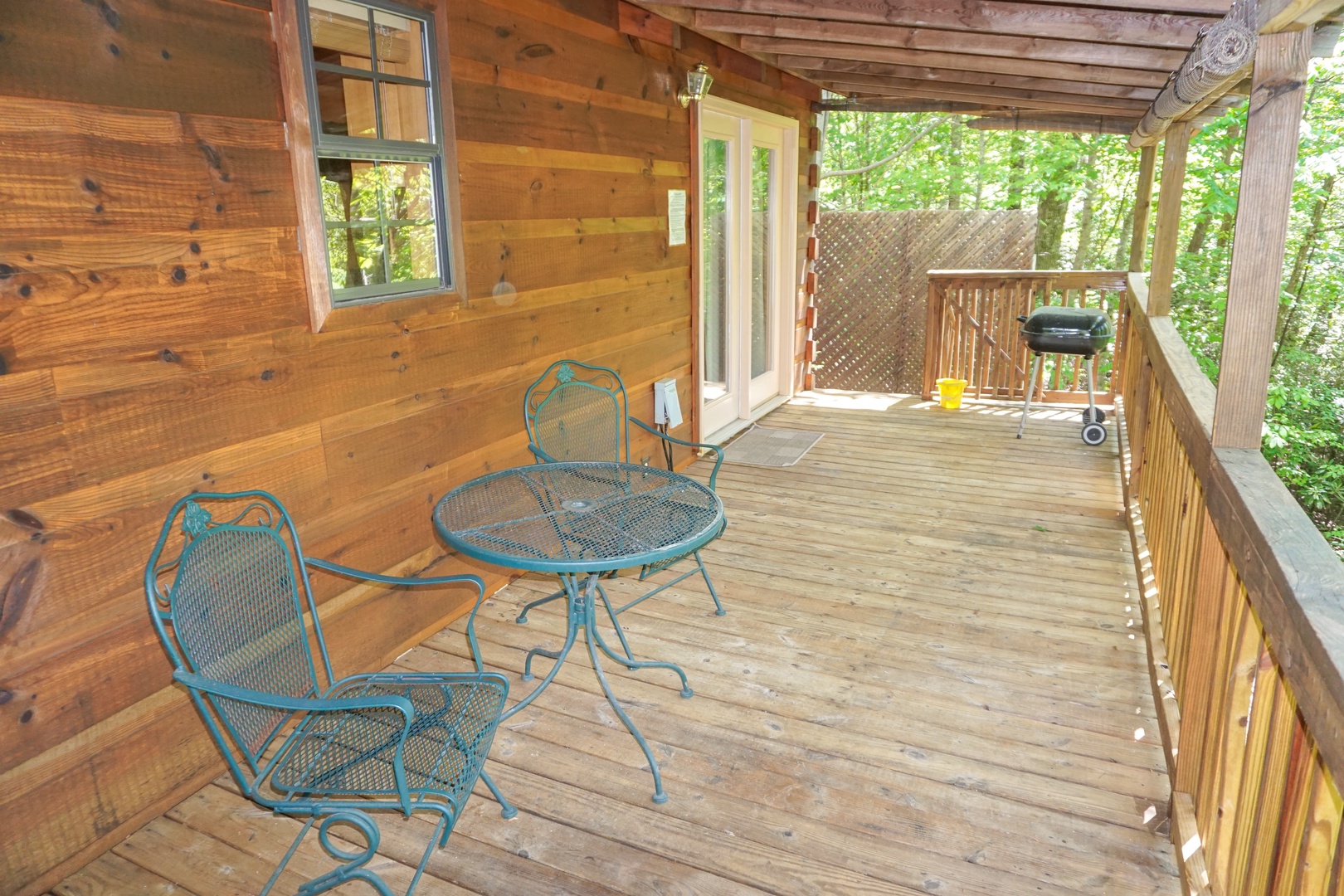 Charcoal grill on the deck at Seclusion, a 1 bedroom cabin rental located in Gatlinburg