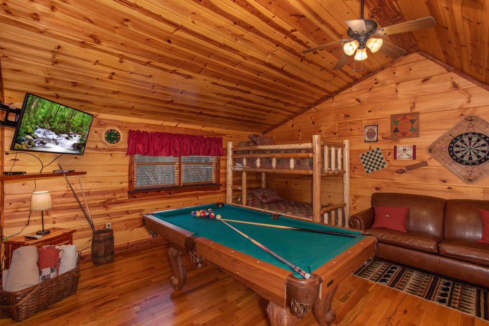Loft with a pool table, TV, and bunk beds at Moonshiner's Ridge, a 1-bedroom cabin rental located in Pigeon Forge