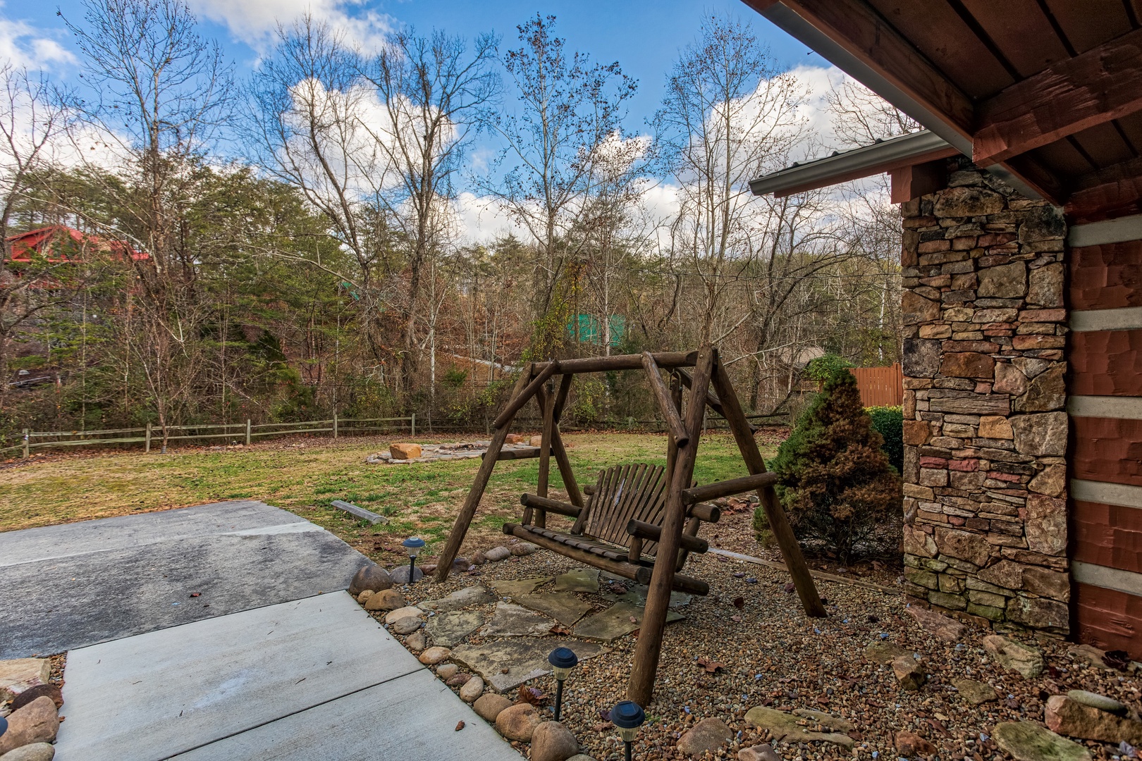 Swing in the yard at Rustic Ranch, a 2 bedroom cabin rental located in Pigeon Forge