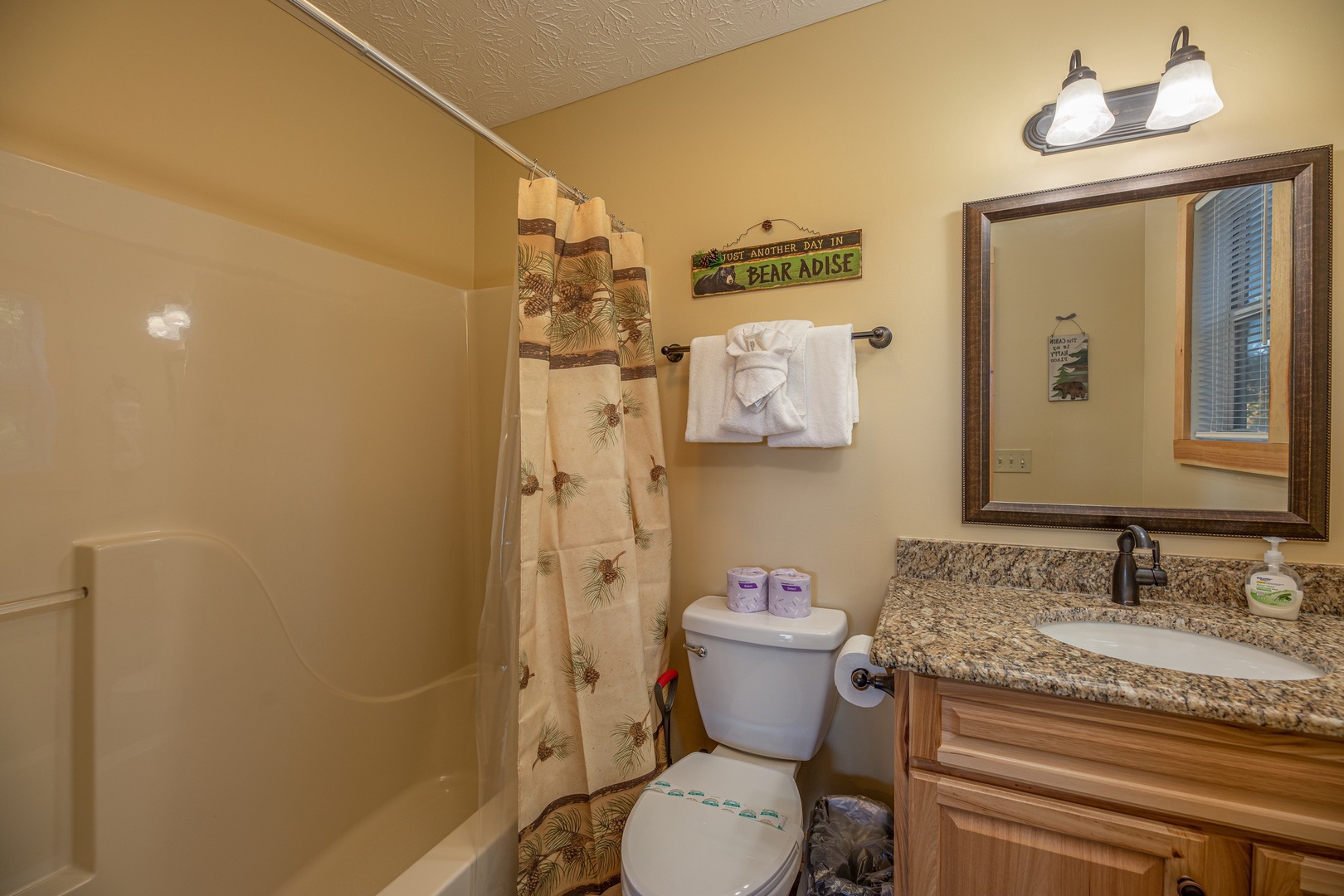 Bathroom with a tub and shower at Le Bear Chalet, a 7 bedroom cabin rental located in Gatlinburg