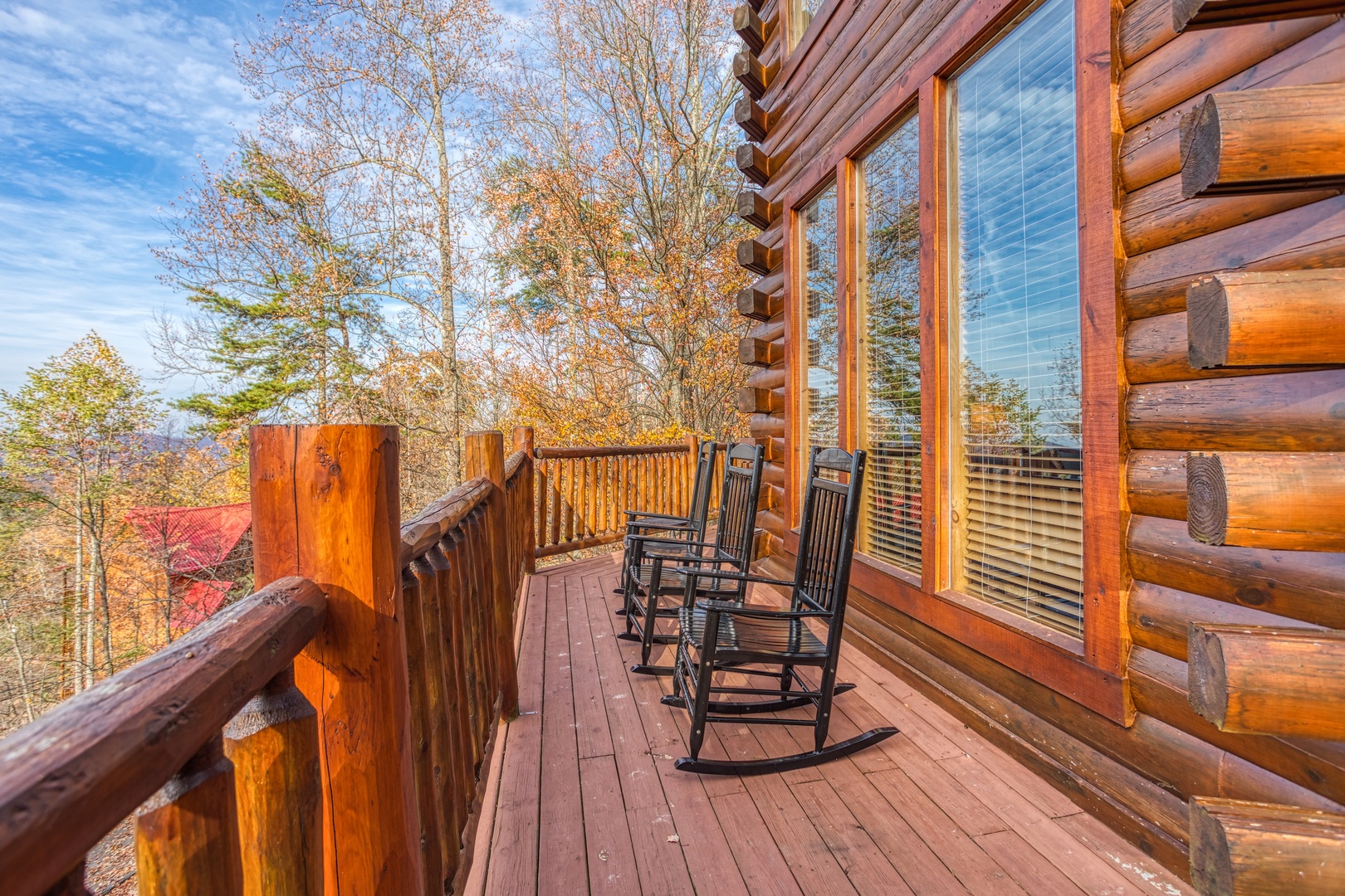 Rocking chairs on the deck at The Original American Dream, a 2 bedroom cabin rental located in Gatlinburg