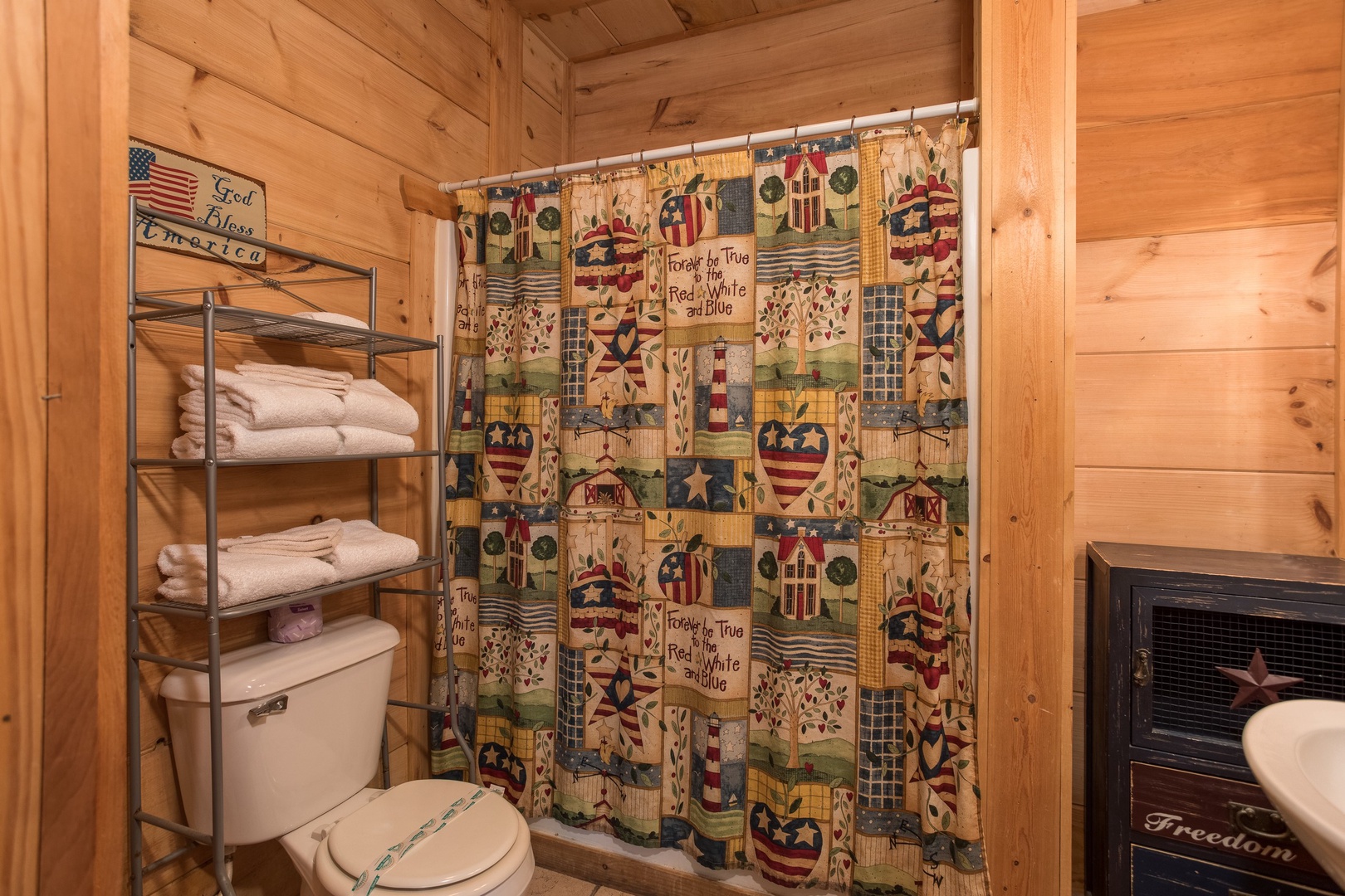 Bathroom with a tub and shower at Patriot Pointe, a 5 bedroom cabin rental located in Pigeon Forge
