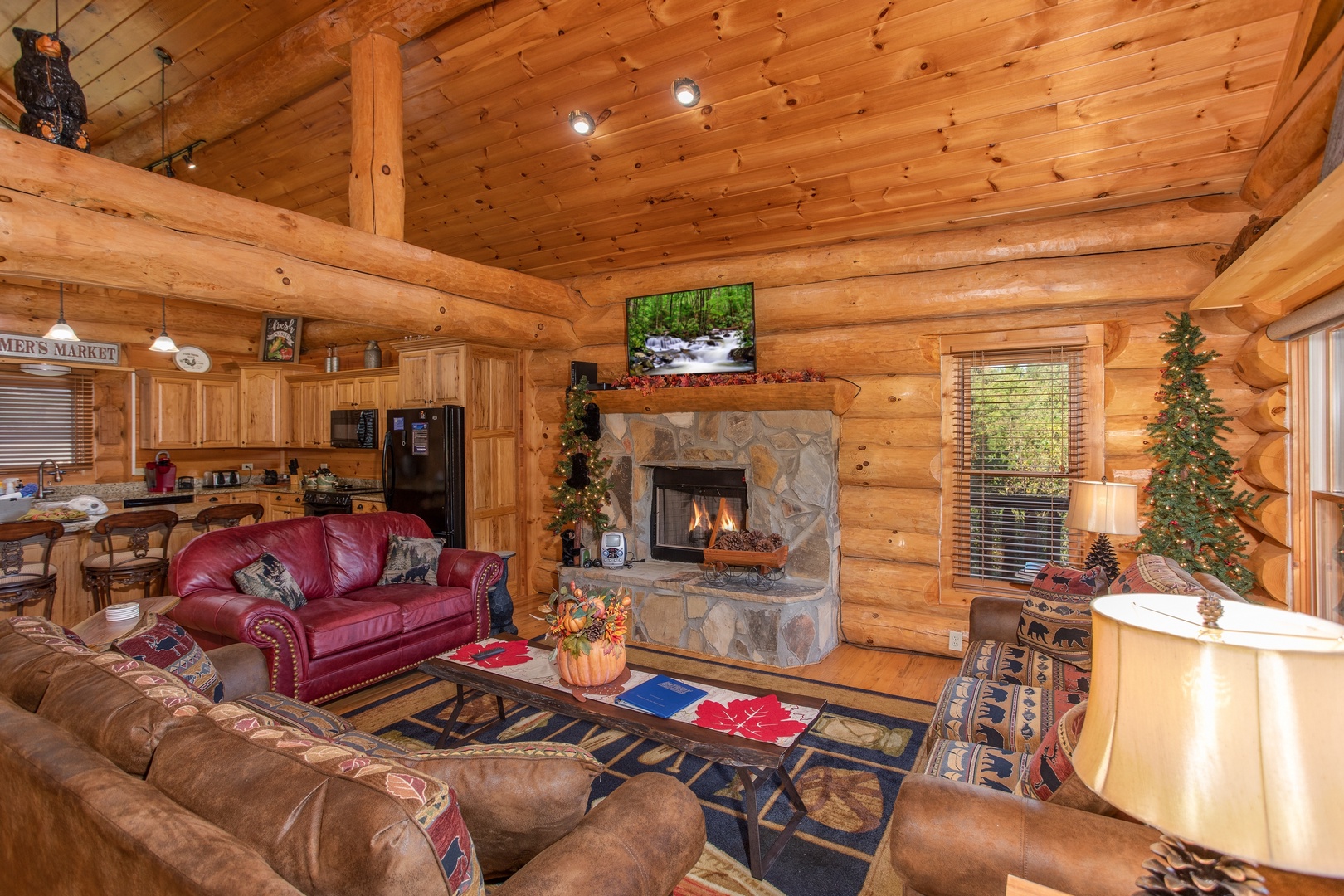 Fireplace and TV in the living room at Great View Lodge, a 5-bedroom cabin rental located in Pigeon Forge
