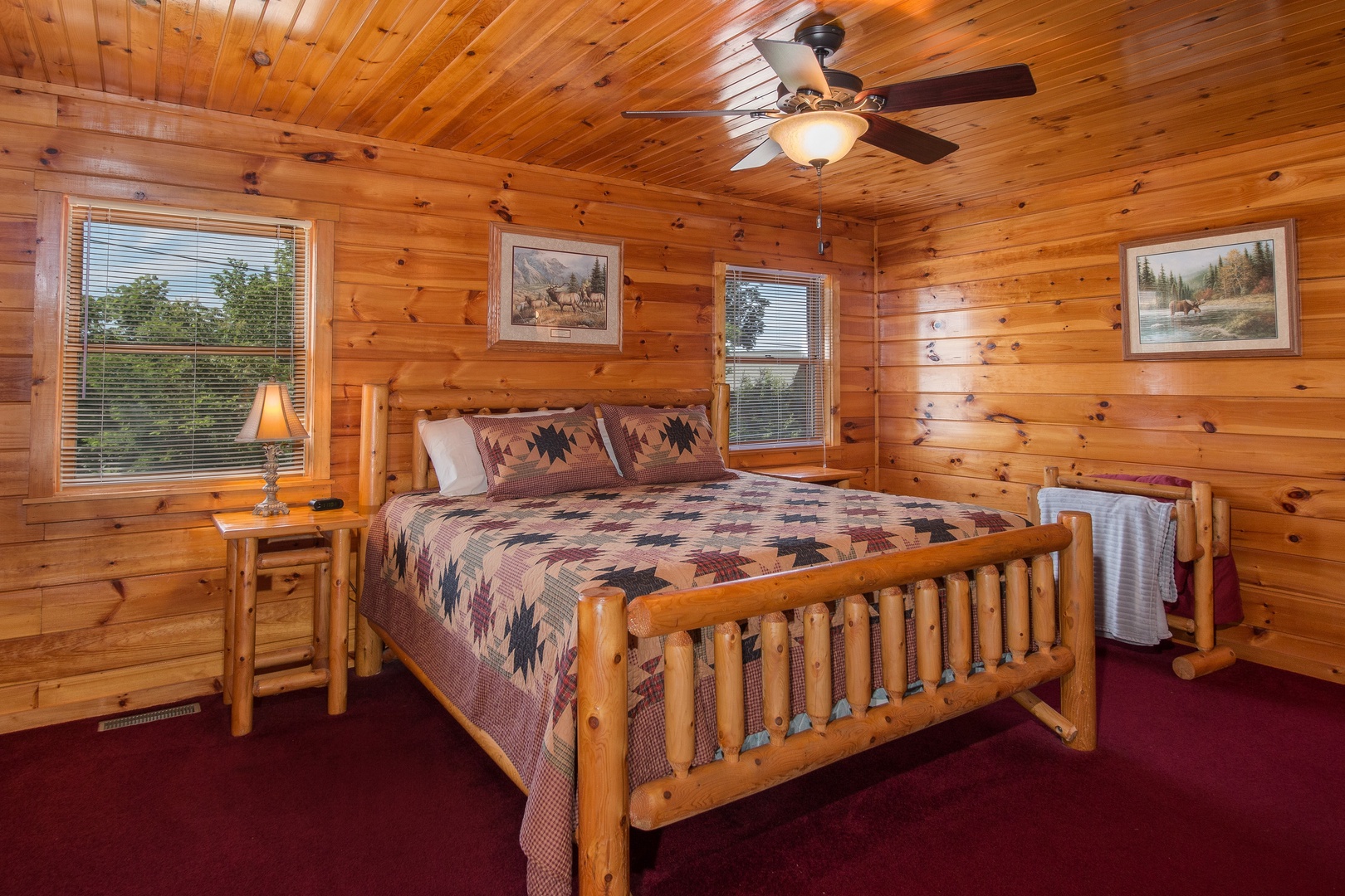 Bedroom with a king log bed at Moose Lodge, a 4 bedroom cabin rental located in Sevierville