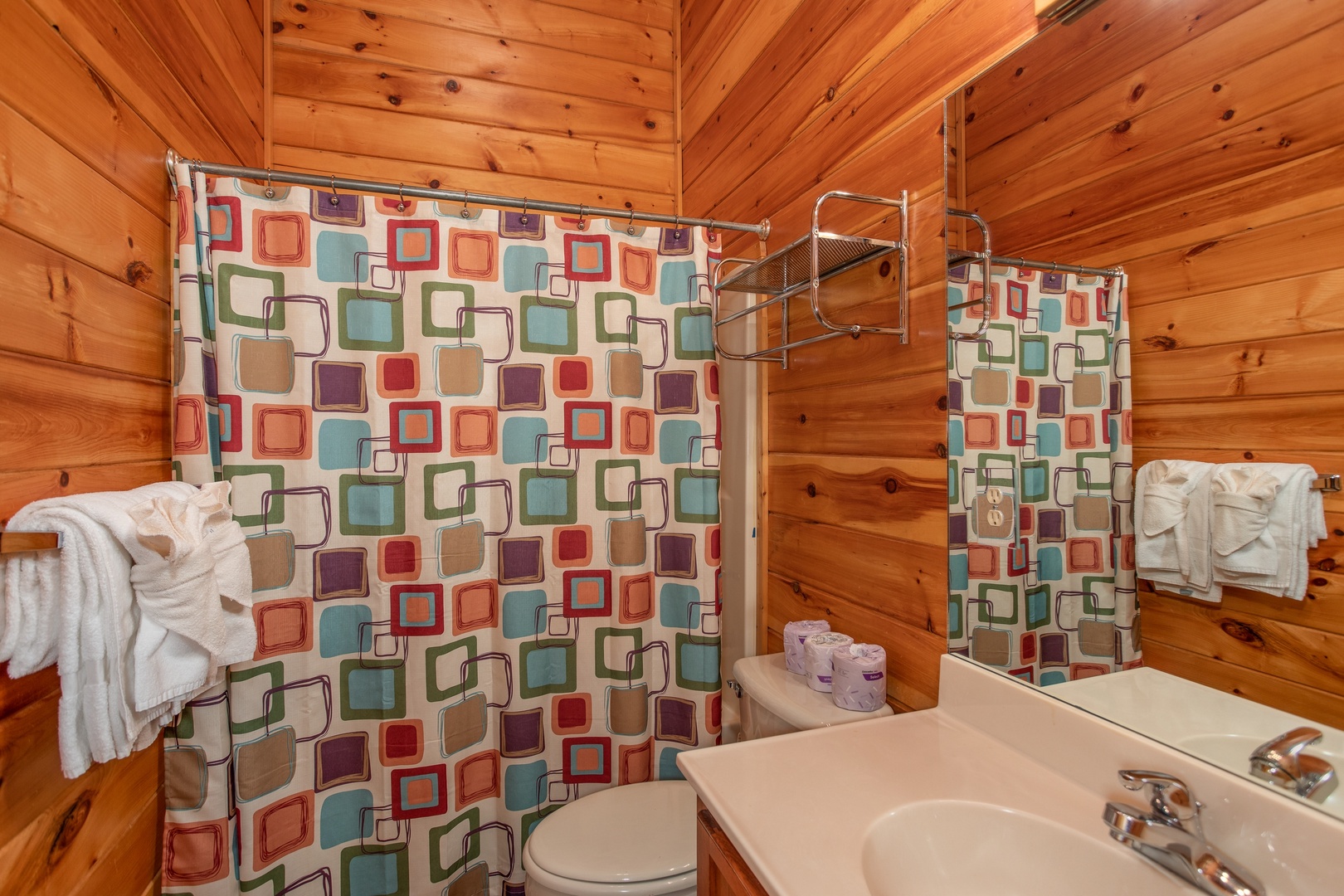 Bathroom with a tub and shower in the loft at Mountain Music, a 5 bedroom cabin rental located in Pigeon Forge