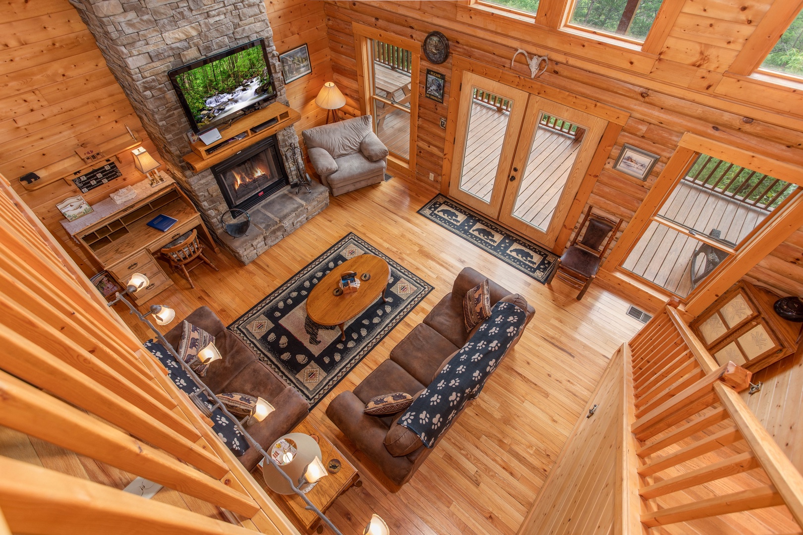 Looking down into the living room from the upper floor at I Do Love Views, a 3 bedroom cabin rental located in Pigeon Forge