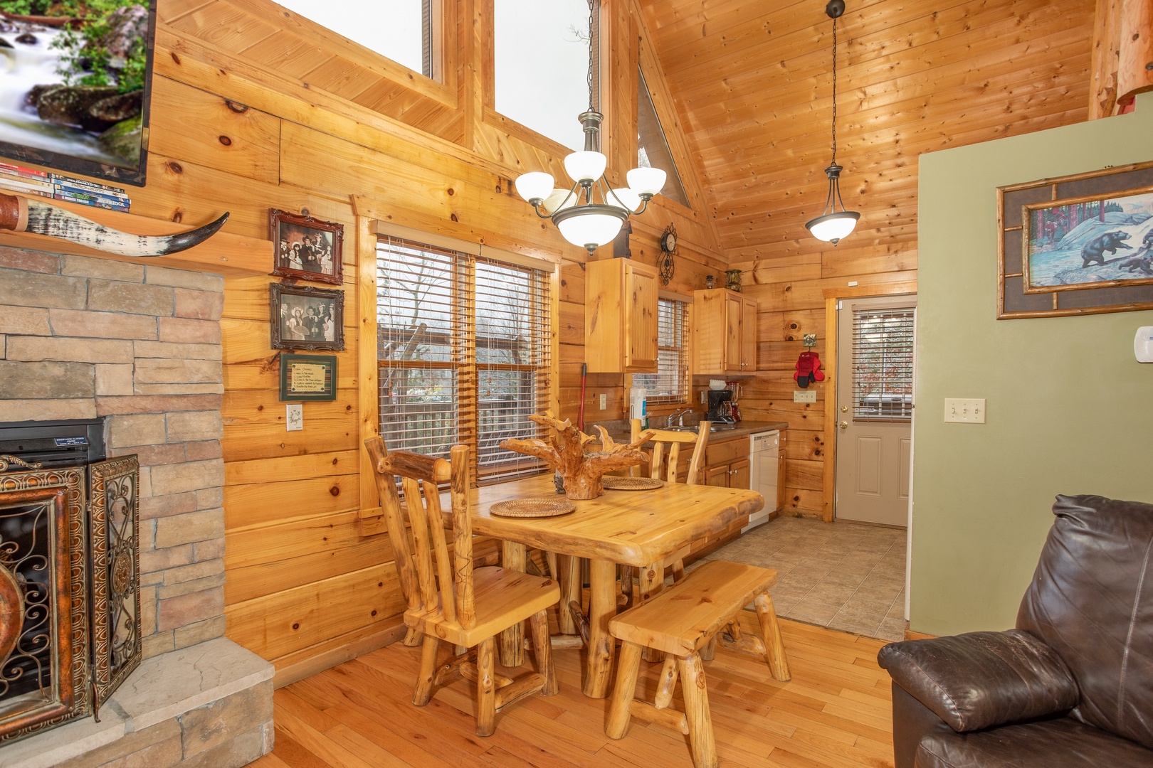 Dining table in the living area at Alpine Romance, a 2 bedroom cabin rental located in Pigeon Forge