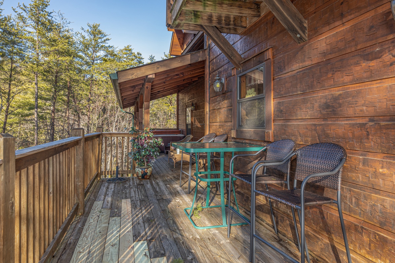 Dining space on the lower deck at King of the Mountain, a 3 bedroom cabin rental located in Pigeon Forge