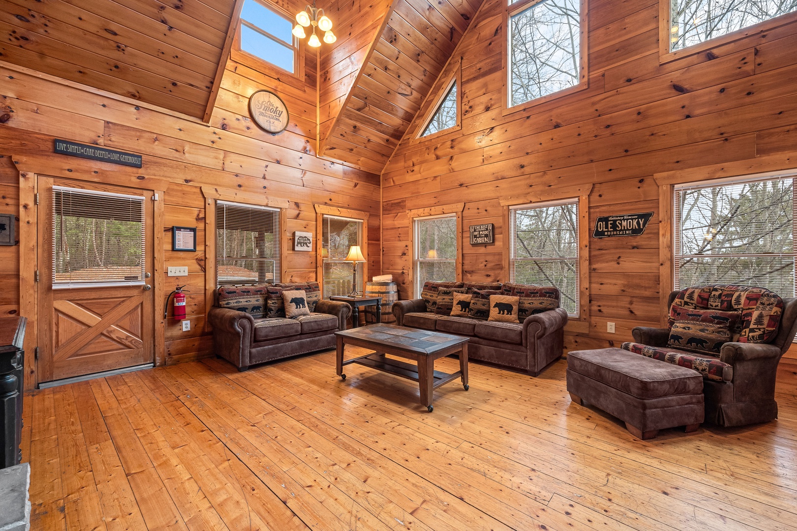 Sofa and chair in the living room at Moonshine Memories, a 2 bedroom cabin rental located in Gatlinburg