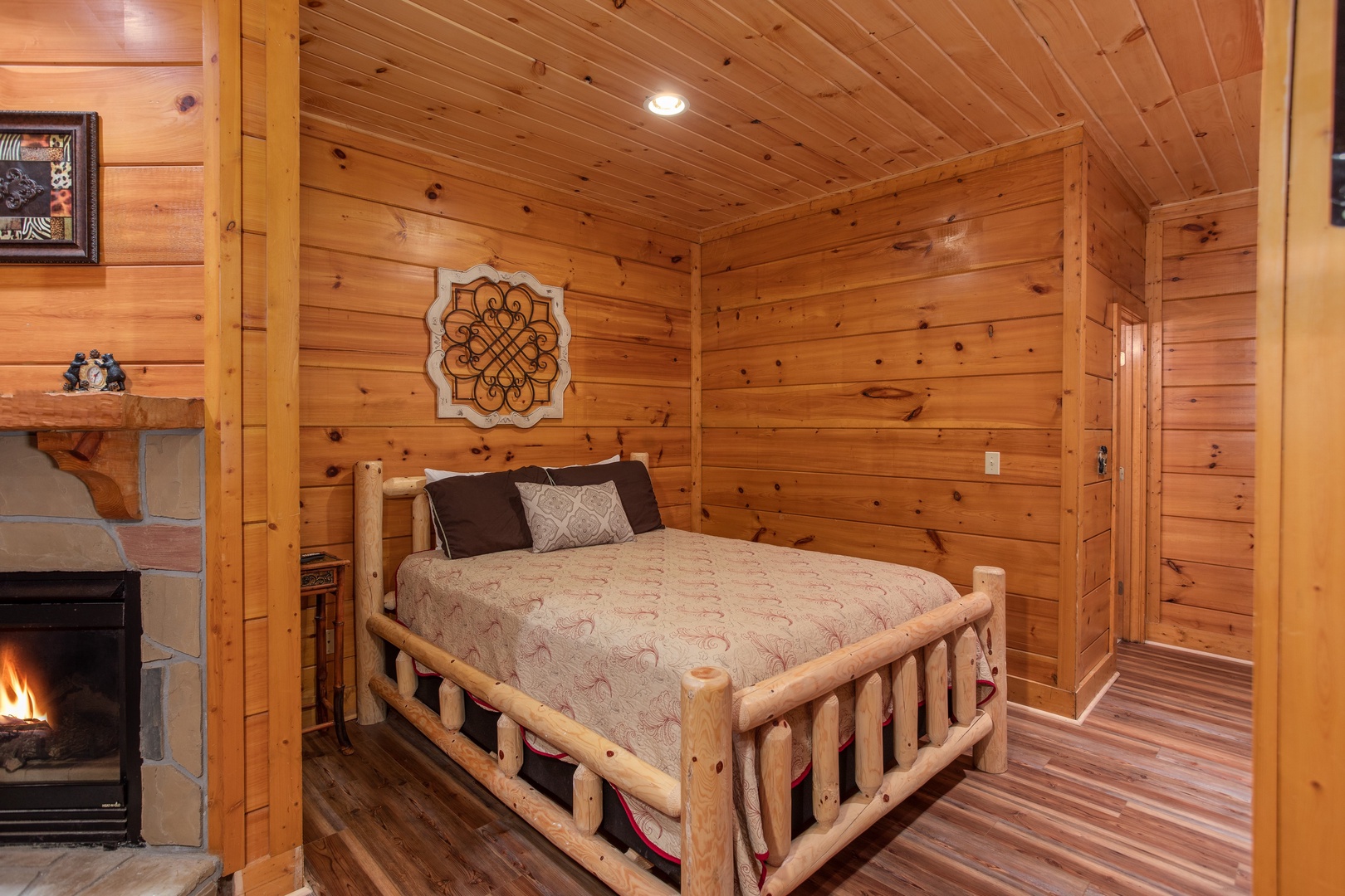 Bedroom with a log bed at Starry Starry Night #725, a 2 bedroom cabin rental located in Pigeon Forge