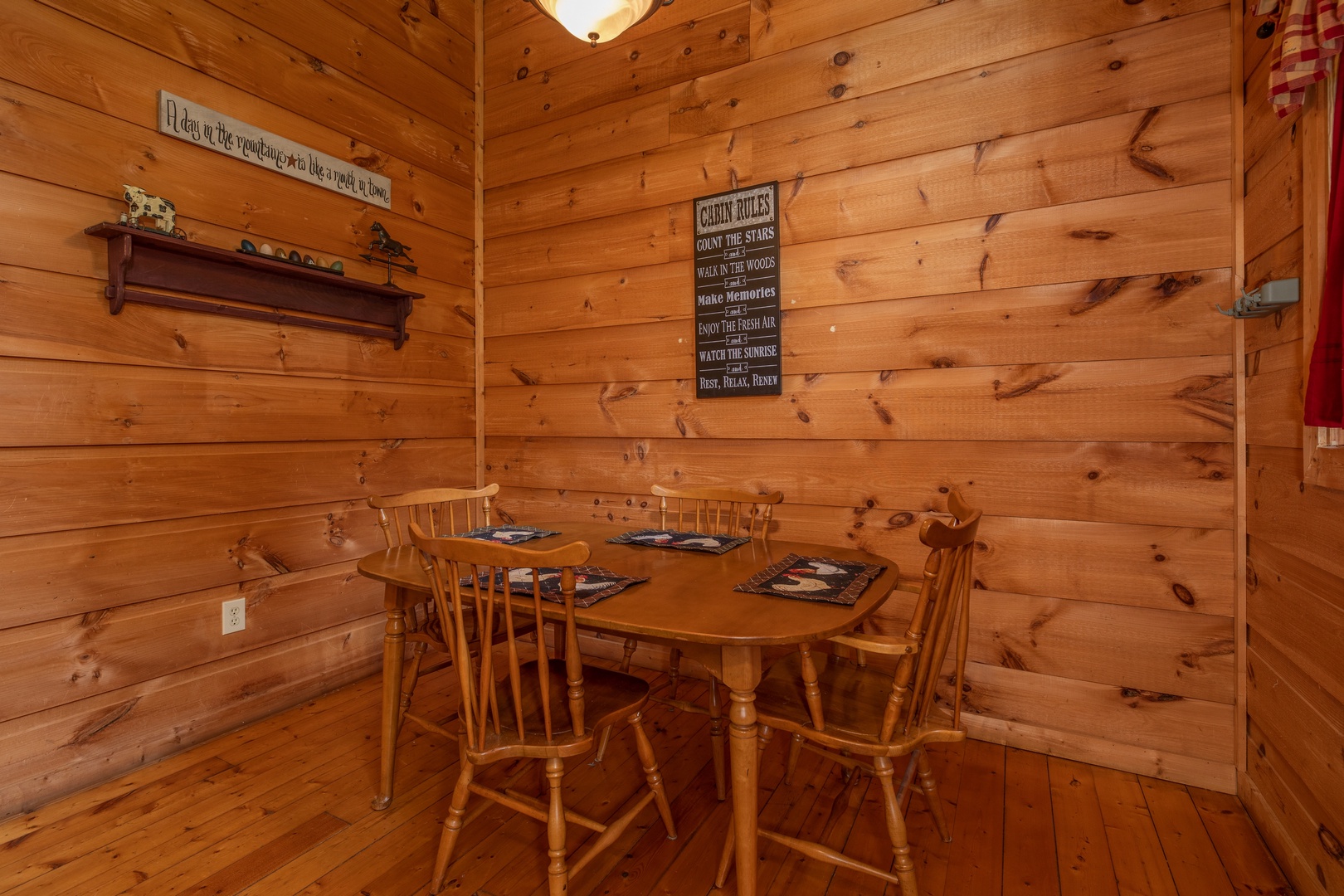 Dining table for four at Logan's Smoky Den, a 2 bedroom cabin rental located in Pigeon Forge