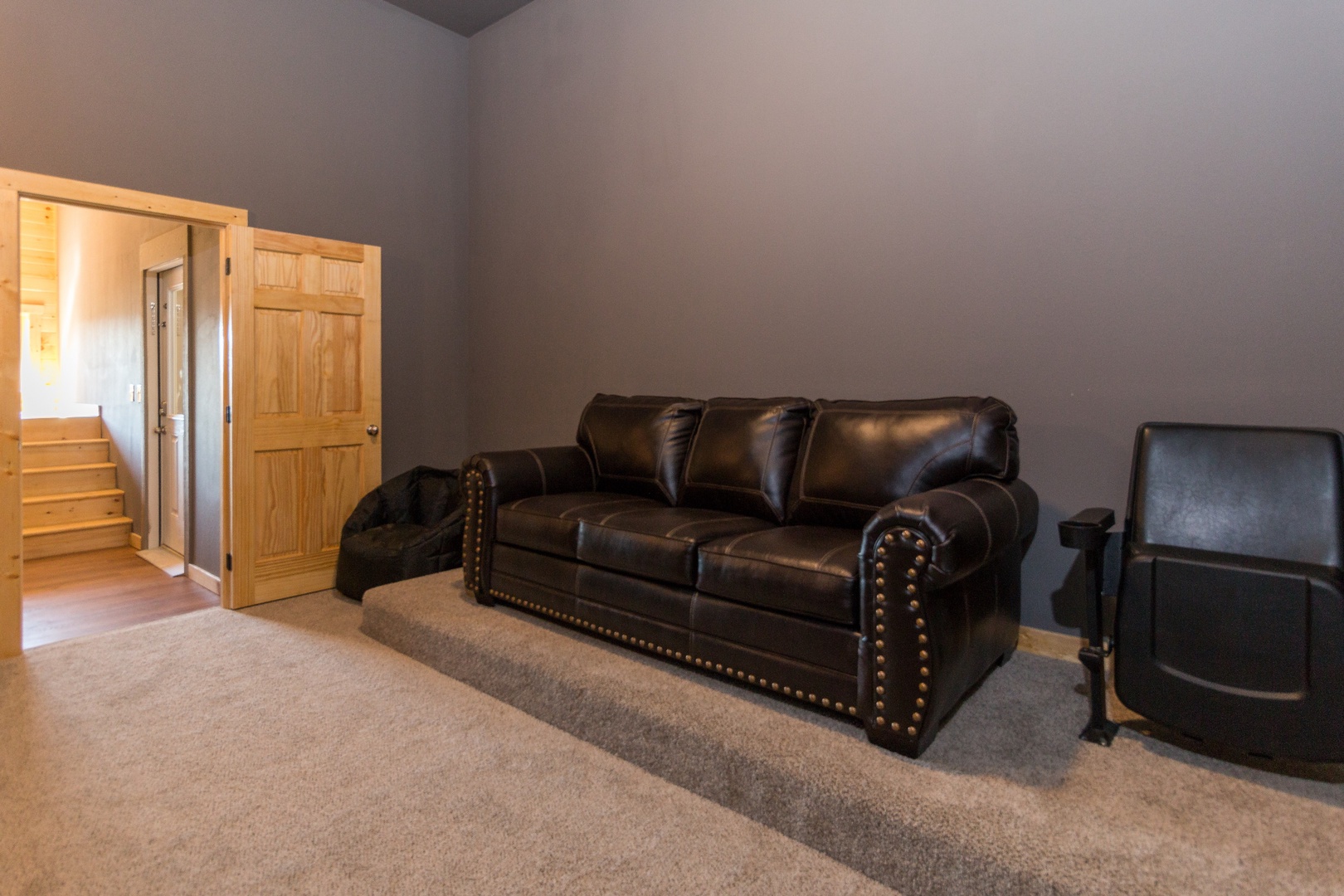 Seating in the theater room at Canyon Camp Falls, a 2 bedroom cabin rental located in Pigeon Forge