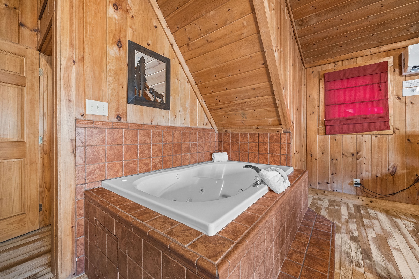 Jacuzzi in a bedroom at A Beary Nice Cabin, a 2 bedroom cabin rental located in Pigeon Forge