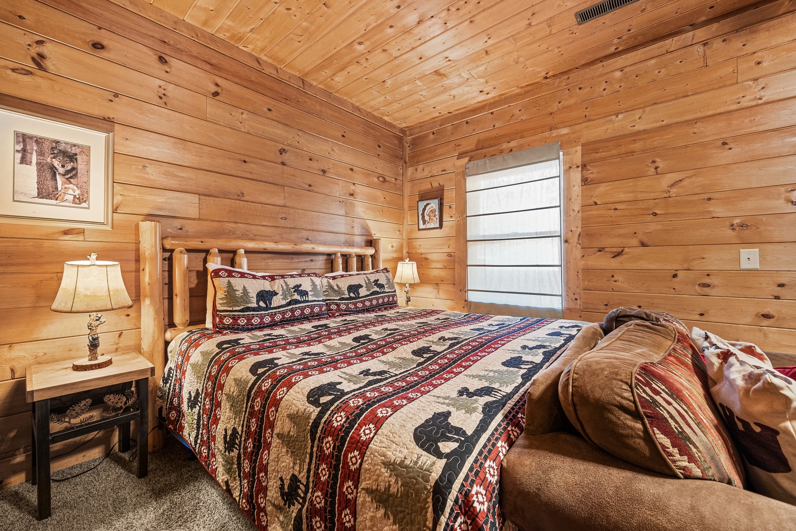 Bedroom with Wooden King Bed at A Beary Nice Cabin, a 2 bedroom cabin rental located in Pigeon Forge