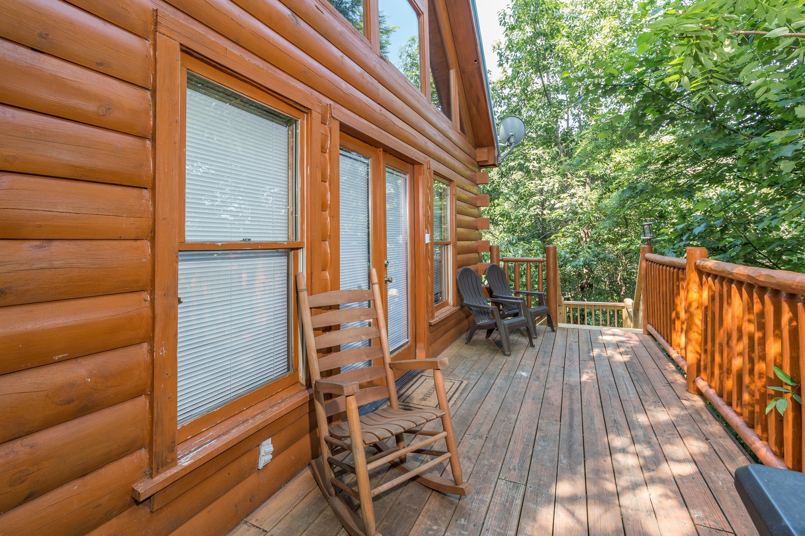 Rocking chair on a deck at Bearstone Cabin, a 1 bedroom cabin rental located in Gatlinburg