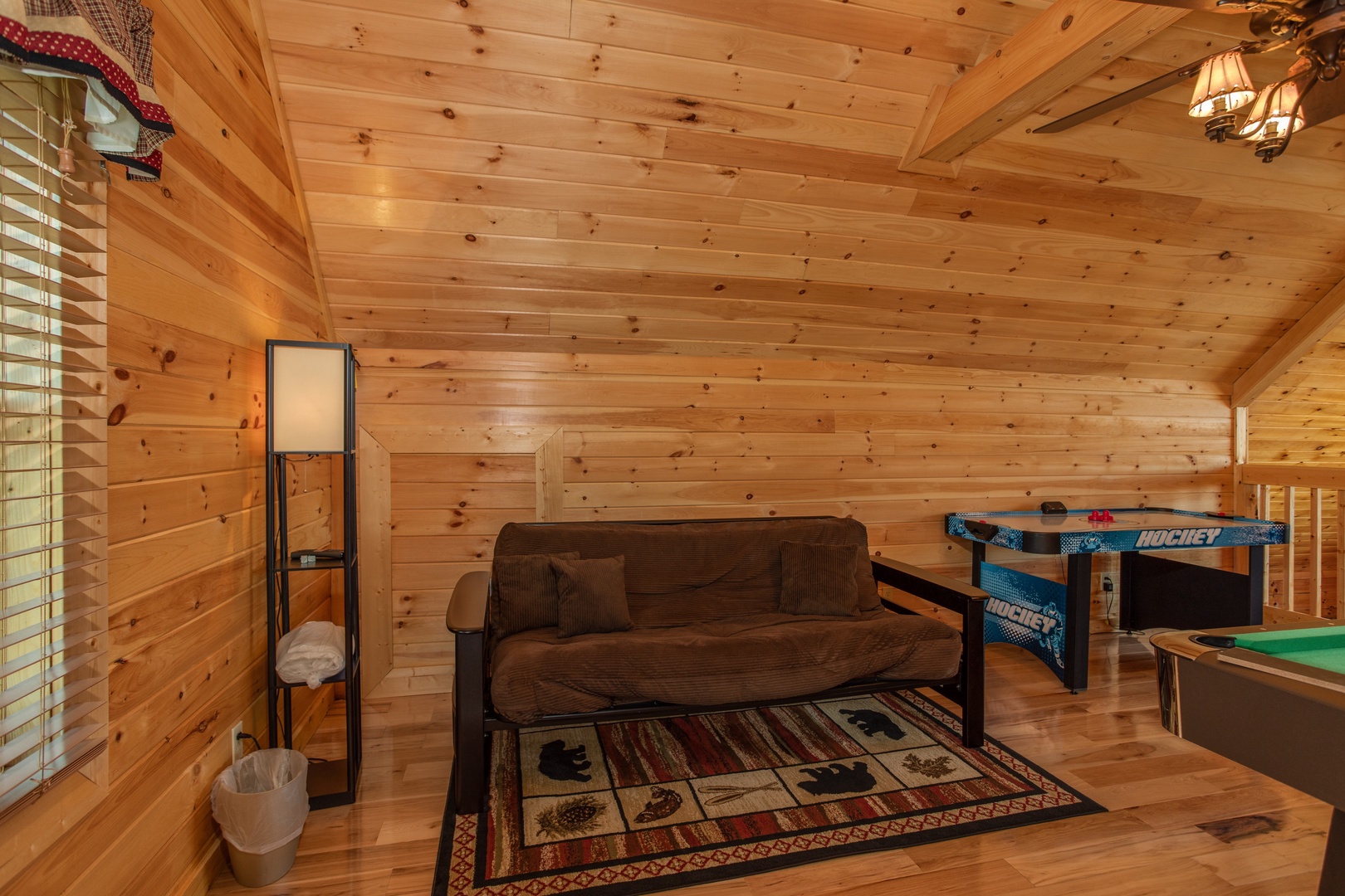 Futon in the loft at Momma Bear, a 2 bedroom cabin rental located in Pigeon Forge