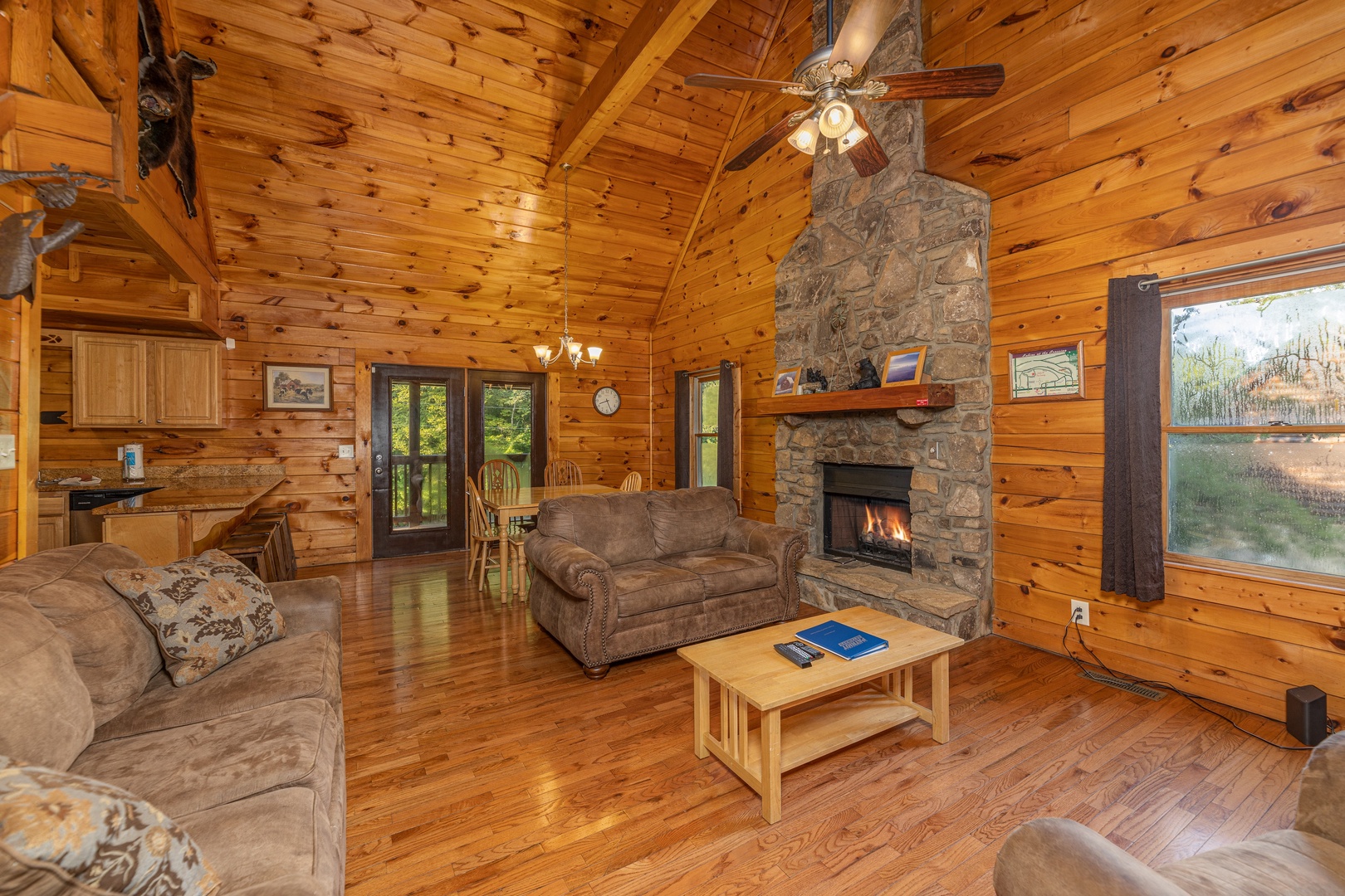Seating and fireplace in a living room at Family Getaway, a 4 bedroom cabin rental located in Pigeon Forge