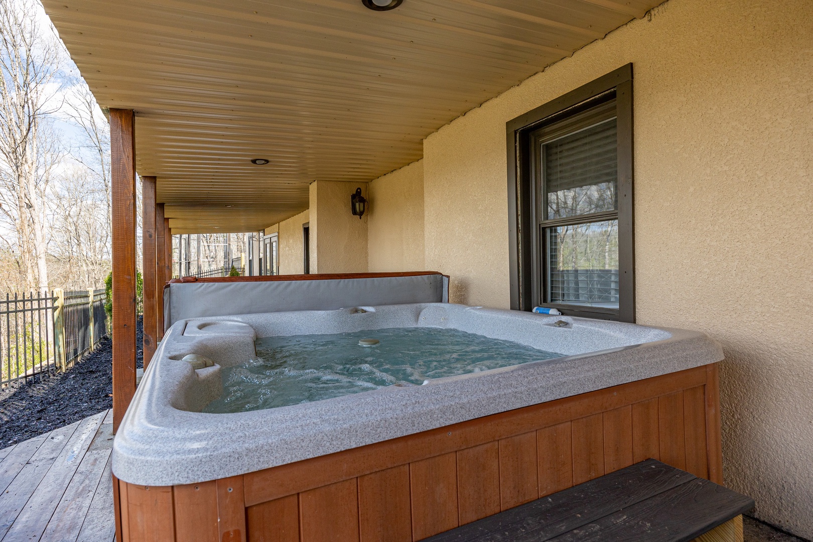 Hot Tub on Covered Deck at Hoop Dreams Lodge