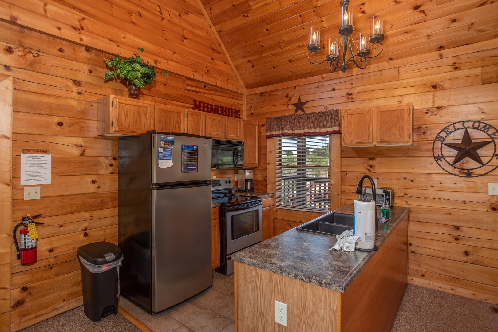 Kitchen and penninsula at Momma Bear, a 2 bedroom cabin rental located in Pigeon Forge