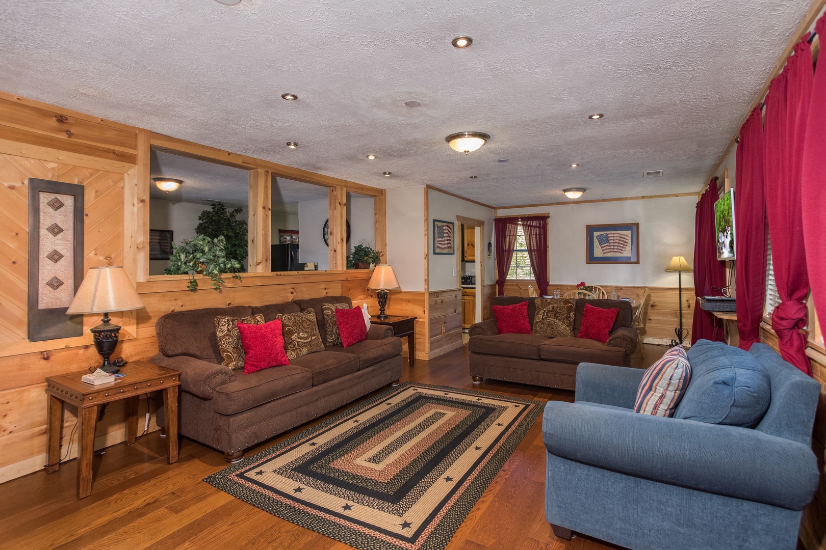 Living room with sofa, loveseat, and chair at Patriot Pointe, a 5 bedroom cabin rental located in Pigeon Forge