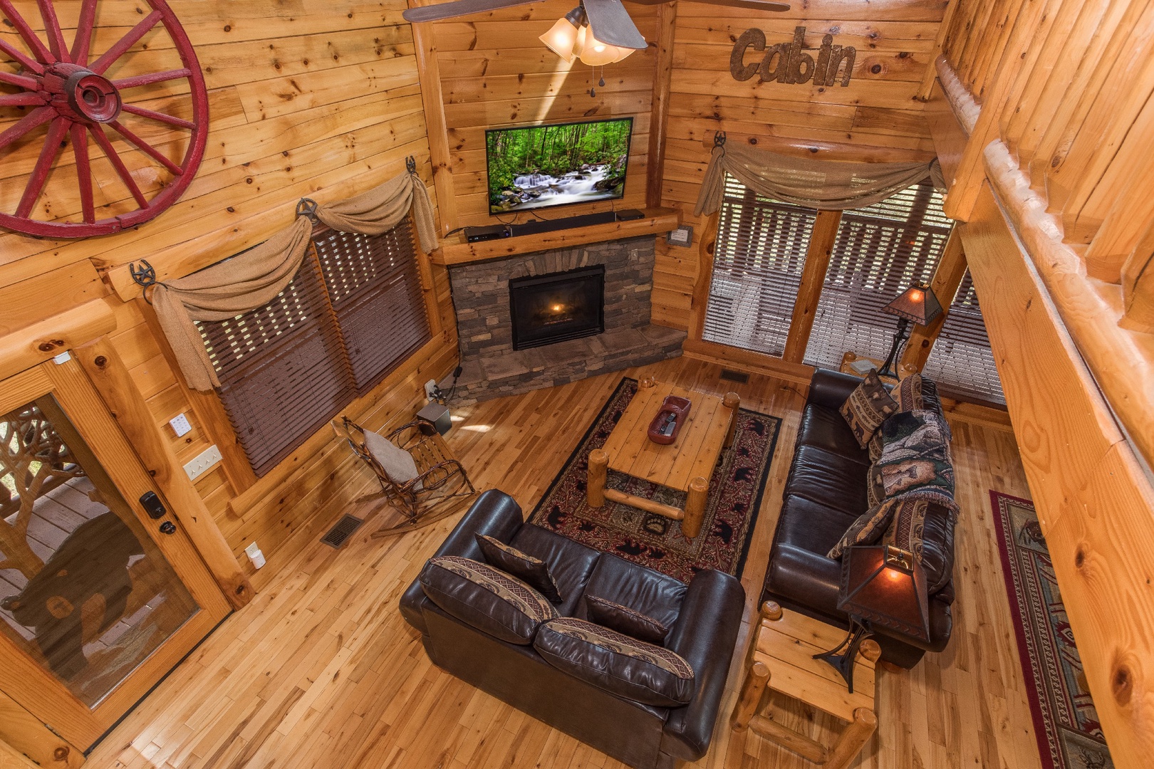 Looking down into the living room at Mountain View Meadows, a 3 bedroom cabin rental located in Pigeon Forge