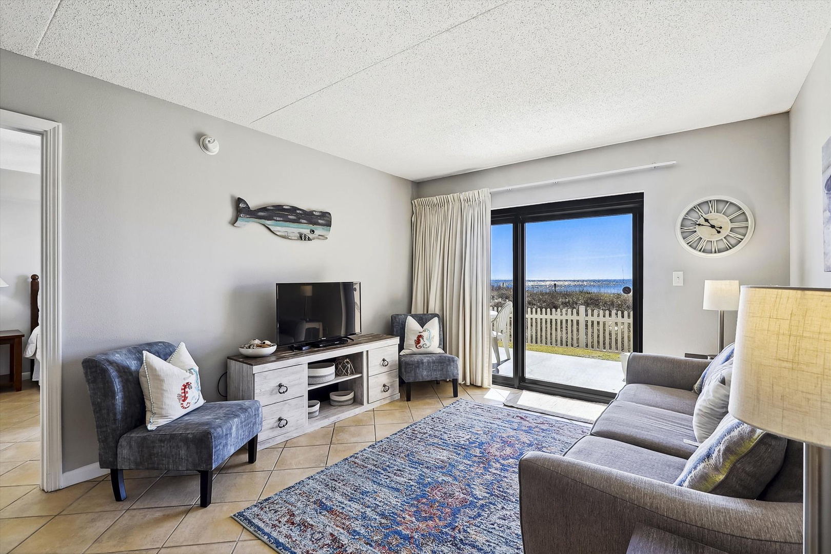 Ocean Breeze West 104 Living room and patio access