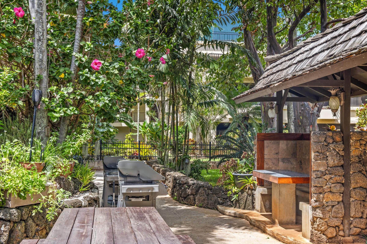 Your private tropical oasis awaits with an outdoor kitchen and lush gardens where you can cook, dine, and unwind surrounded by vibrant blooms.