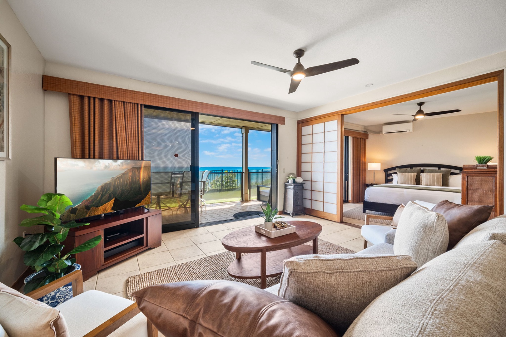 Relax in your sun-filled living room with stunning ocean views, then retreat to your cozy bedroom just steps away—perfect for unwinding after beach adventures.