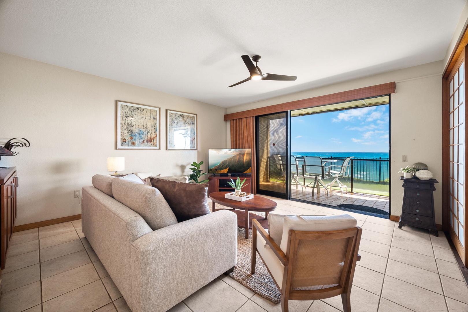 Sink into plush seating as your gaze follows the endless ocean horizon. Open the sliding doors to feel the breeze, step onto your private balcony, and let the sound of waves set your vacation rhythm.