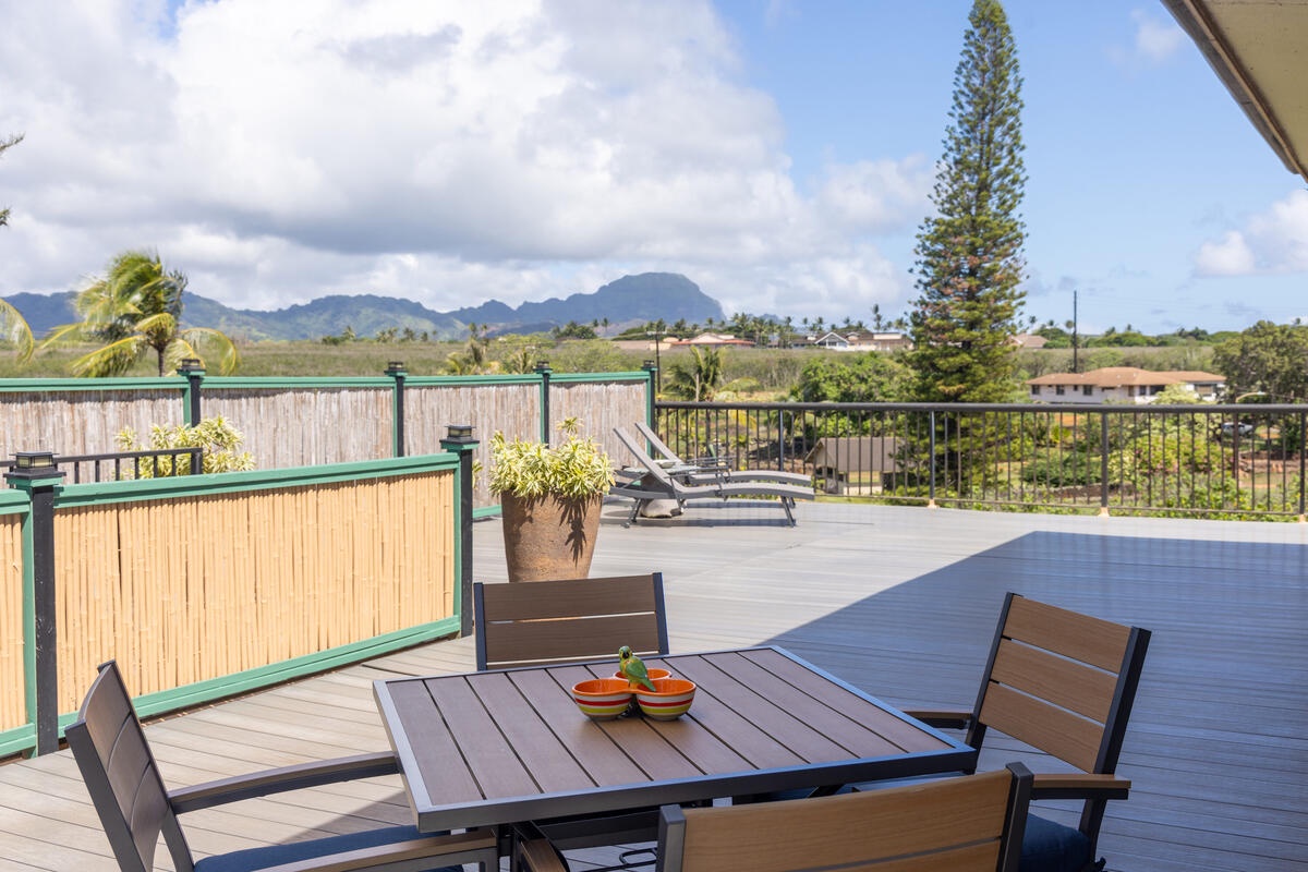 Enjoy your morning coffee at this spacious outdoor dining table while taking in stunning mountain views from your private deck.