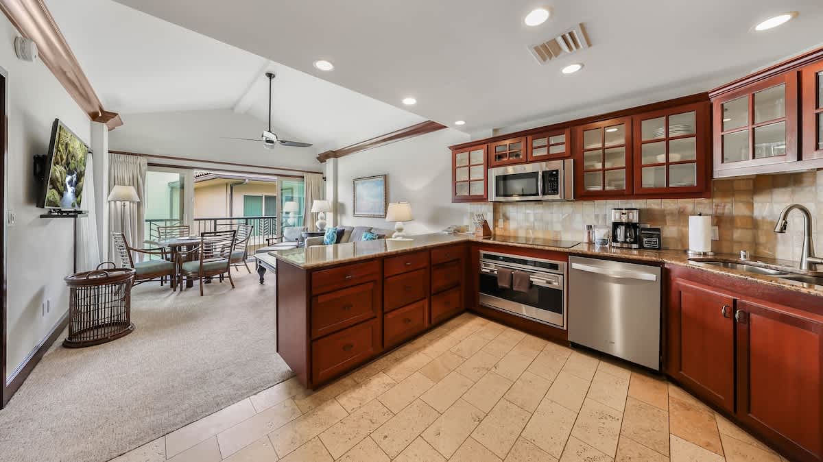 Step into your open-concept haven where a gourmet kitchen flows seamlessly into inviting living and dining spaces. Gleaming cherry cabinetry, stainless steel appliances, and a private balcony await your coastal getaway.