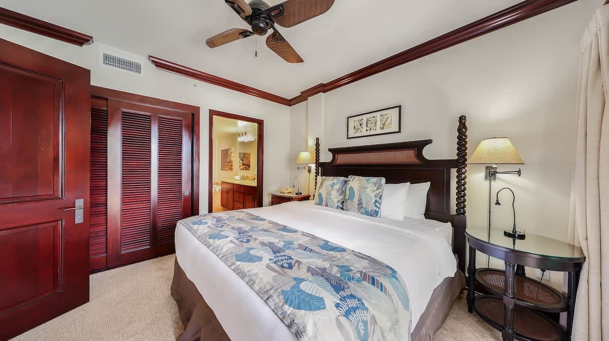 Unwind in your serene bedroom, where crisp linens and coastal-inspired decor invite restful nights. The ceiling fan keeps you comfortable, while bedside lamps let you read or relax on your schedule.