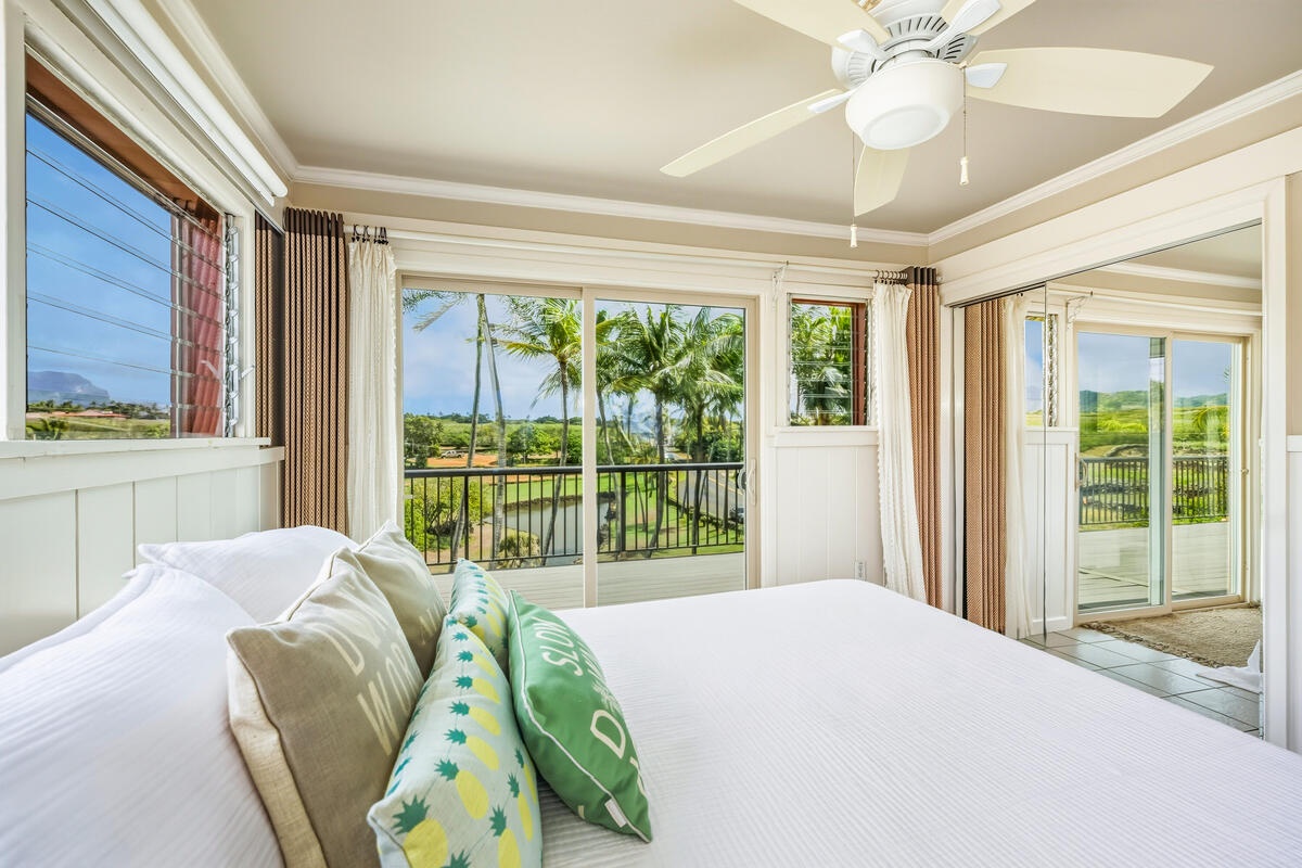 Wake up to stunning tropical views through floor-to-ceiling windows. Your spacious bedroom opens to a private balcony with lush greenery beyond.