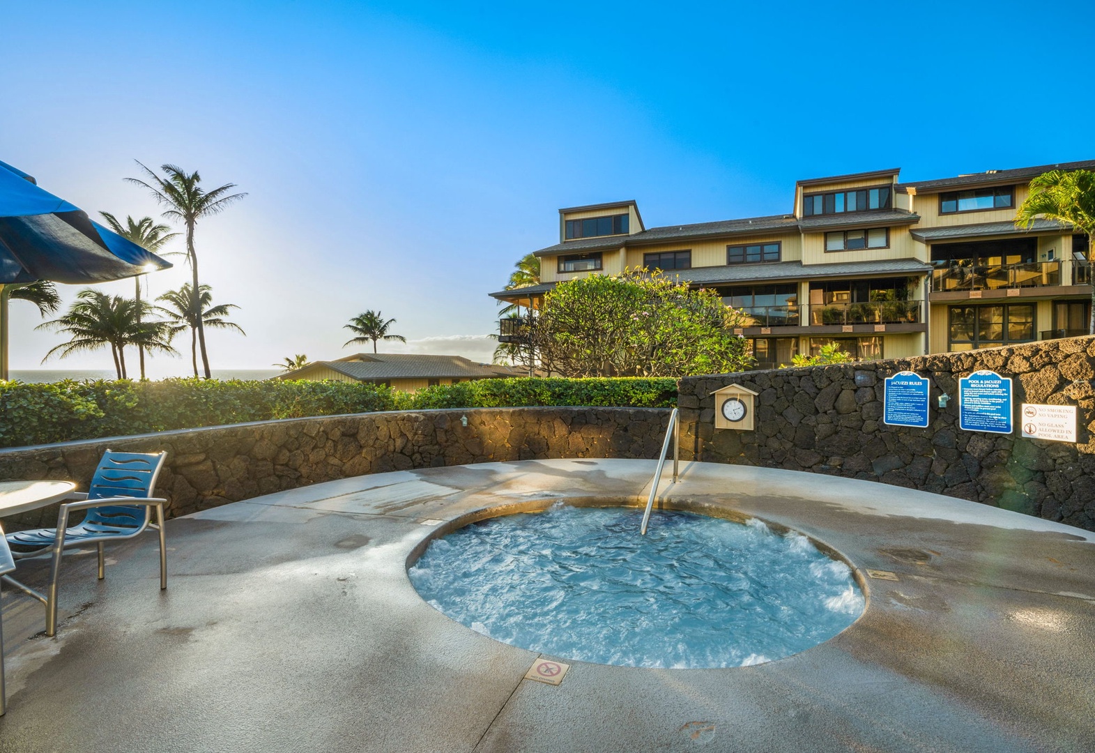 Soak in the bubbling hot tub surrounded by lush palms and tropical ocean breezes, where relaxation meets paradise under the Hawaiian sky.